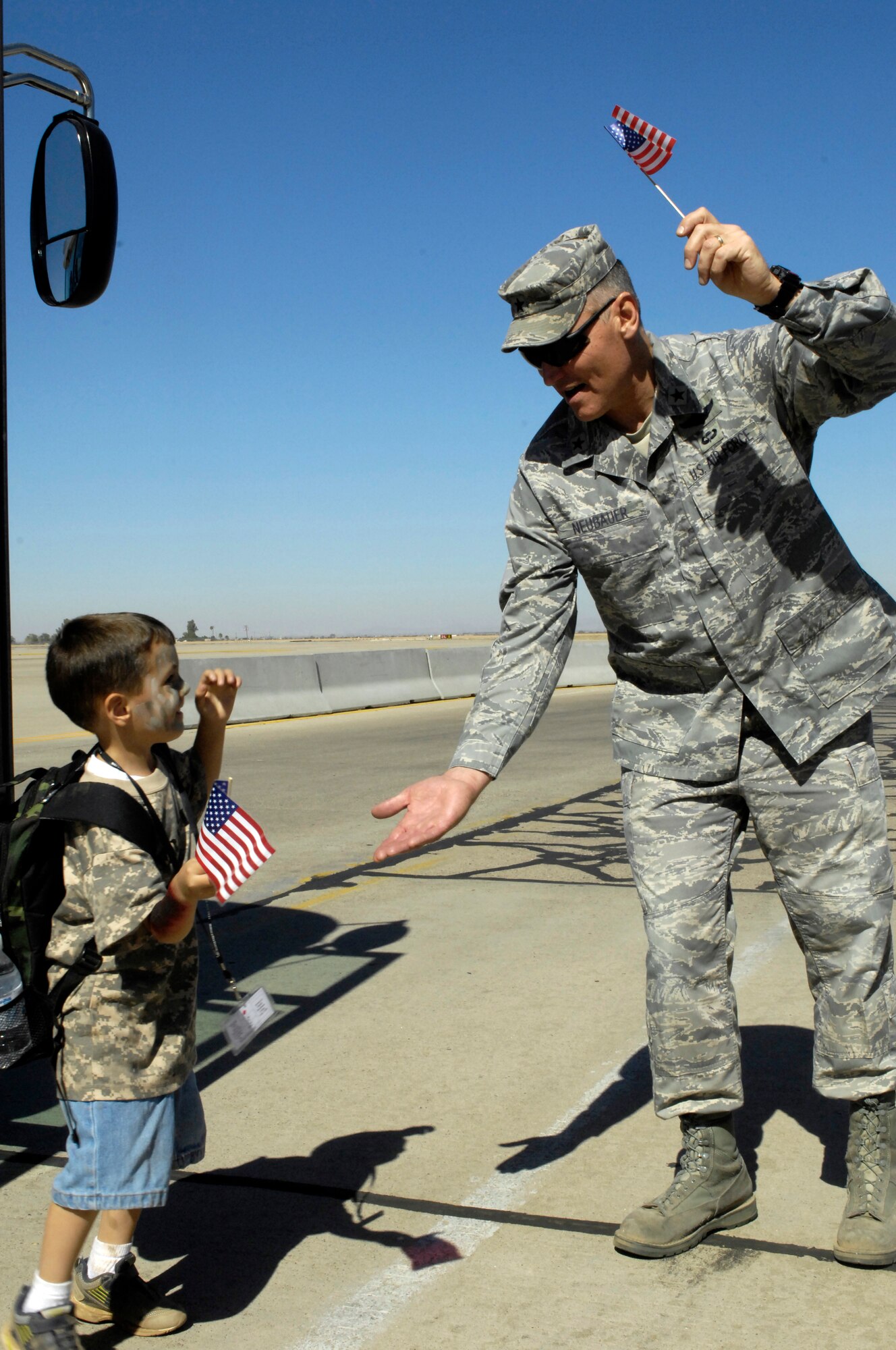 Brig. Gen. Kurt Neubauer, 56th Fighter Wing Commander,greets children that were "deploying" in support of the 2009 Operation Kids event, Oct. 24, 2009, Luke Air Force Base, Arizona. (U.S. Air Force Photo by Staff Sgt. Jason Colbert)