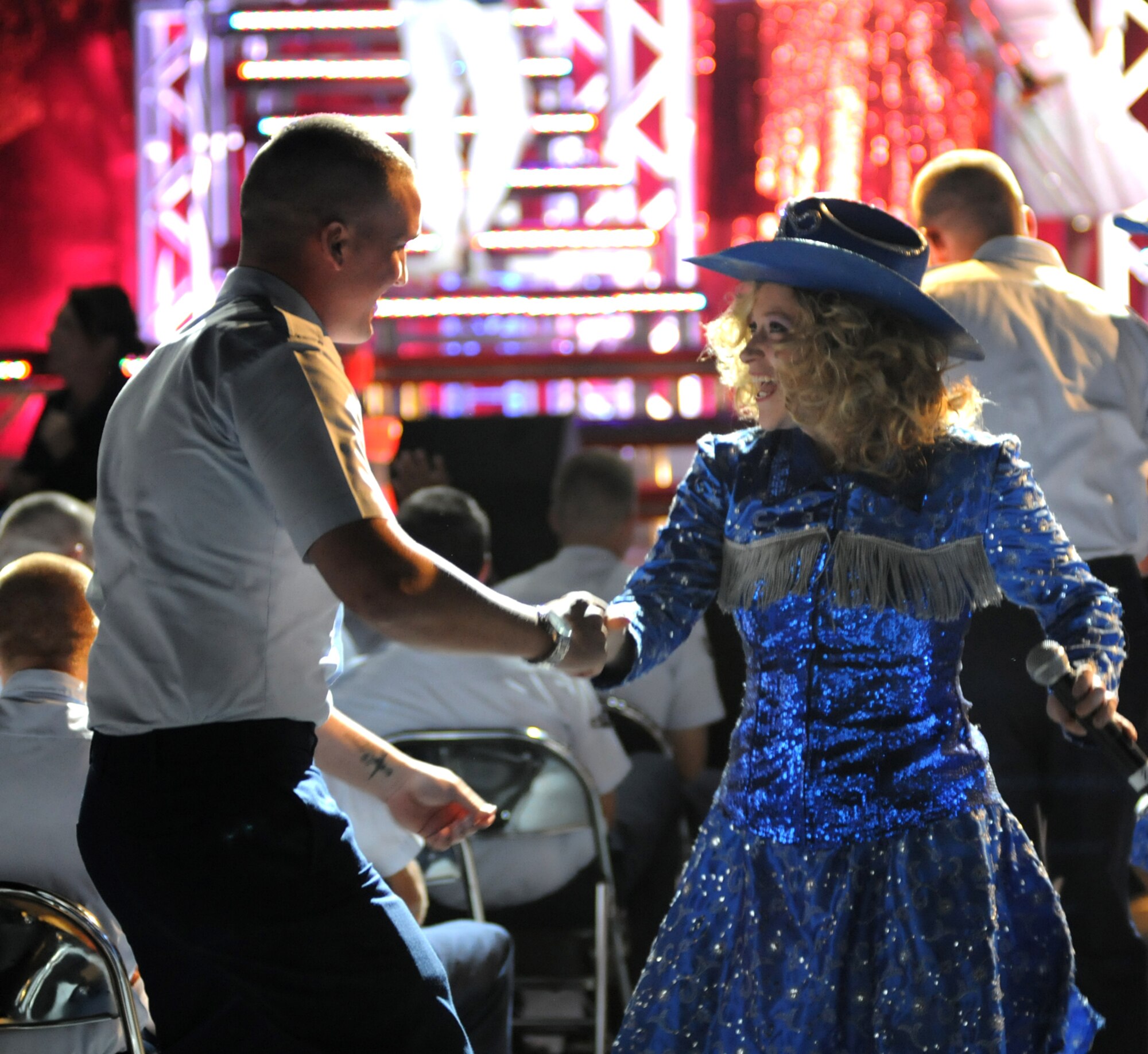 Airman Basic Jonathan Randall, 334th TRS, dances with Senior Airman Jennifer Frost, Robins AFB, Ga. to “Chicken Fried.”  (U.S. Air Force photo by Kemberly Groue)