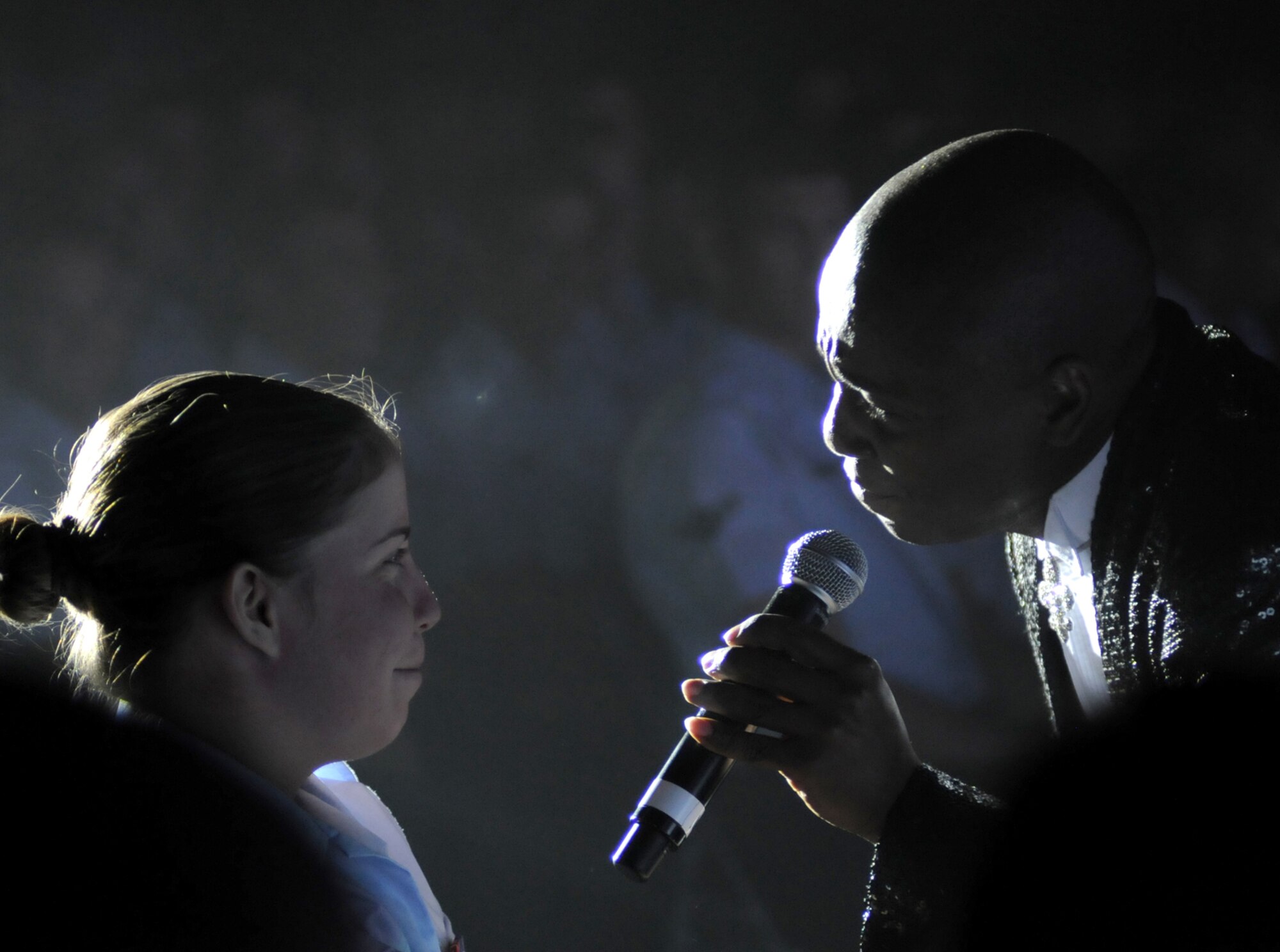 Airman Basic Kimberly Braud, a student in the 334th Training Squadron, is serenaded by Tech. Sgt. Octavious Hill who sang “Forever and Ever Amen” by Randy Travis at Sunday’s Tops in Blue performance at the Mississippi Coast Coliseum in Biloxi.  Sergeant Hill is from Nellis Air Force Base, Nevada. (U.S. Air Force photo by Kemberly Groue)