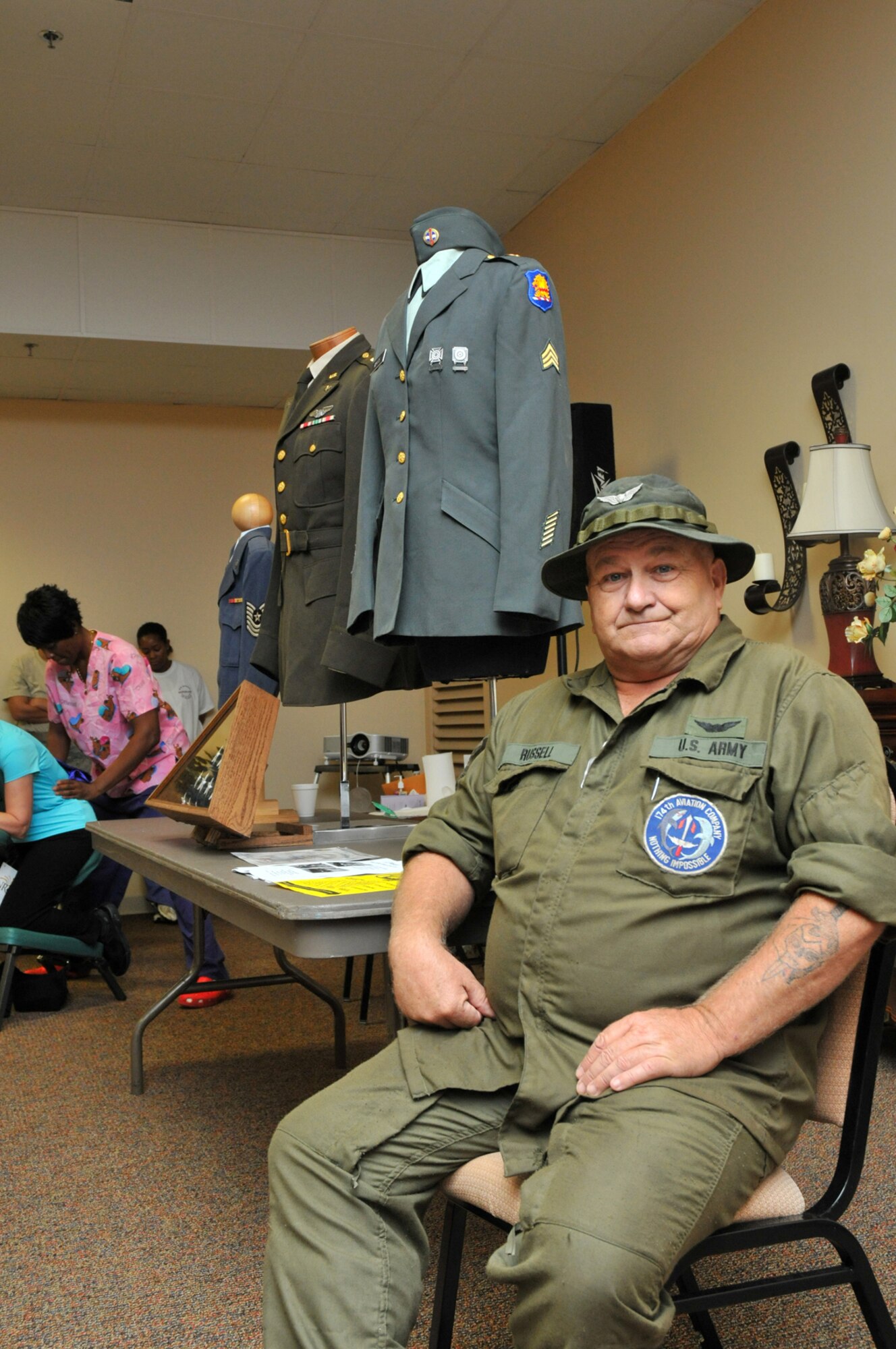 Army retiree Henry Russell of Gautier shows some of the 2,600 items on display at the GI Museum in Gautier.  (U.S. Air Force photo by Adam Bond)