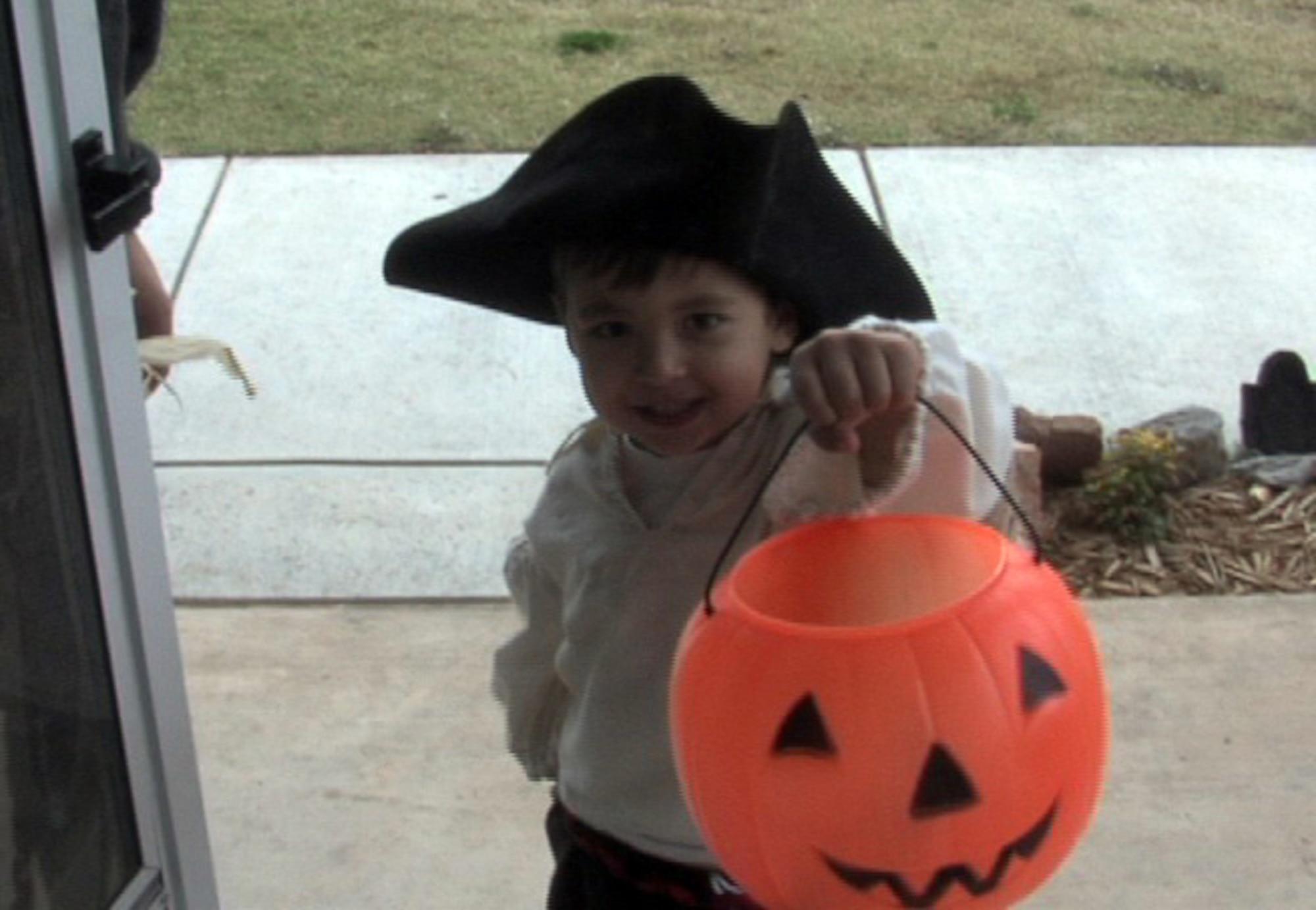 ALTUS AIR FORCE BASE, Okla. --  3 year-old Alex Seidl shouts "Trick-or-Treat" in anticpation of some Halloween candy.  His mom and dad take him door-to-door every October to be sure he stays safe on his sweets search. (U.S. Air Force Photo/Kenny Scarle)