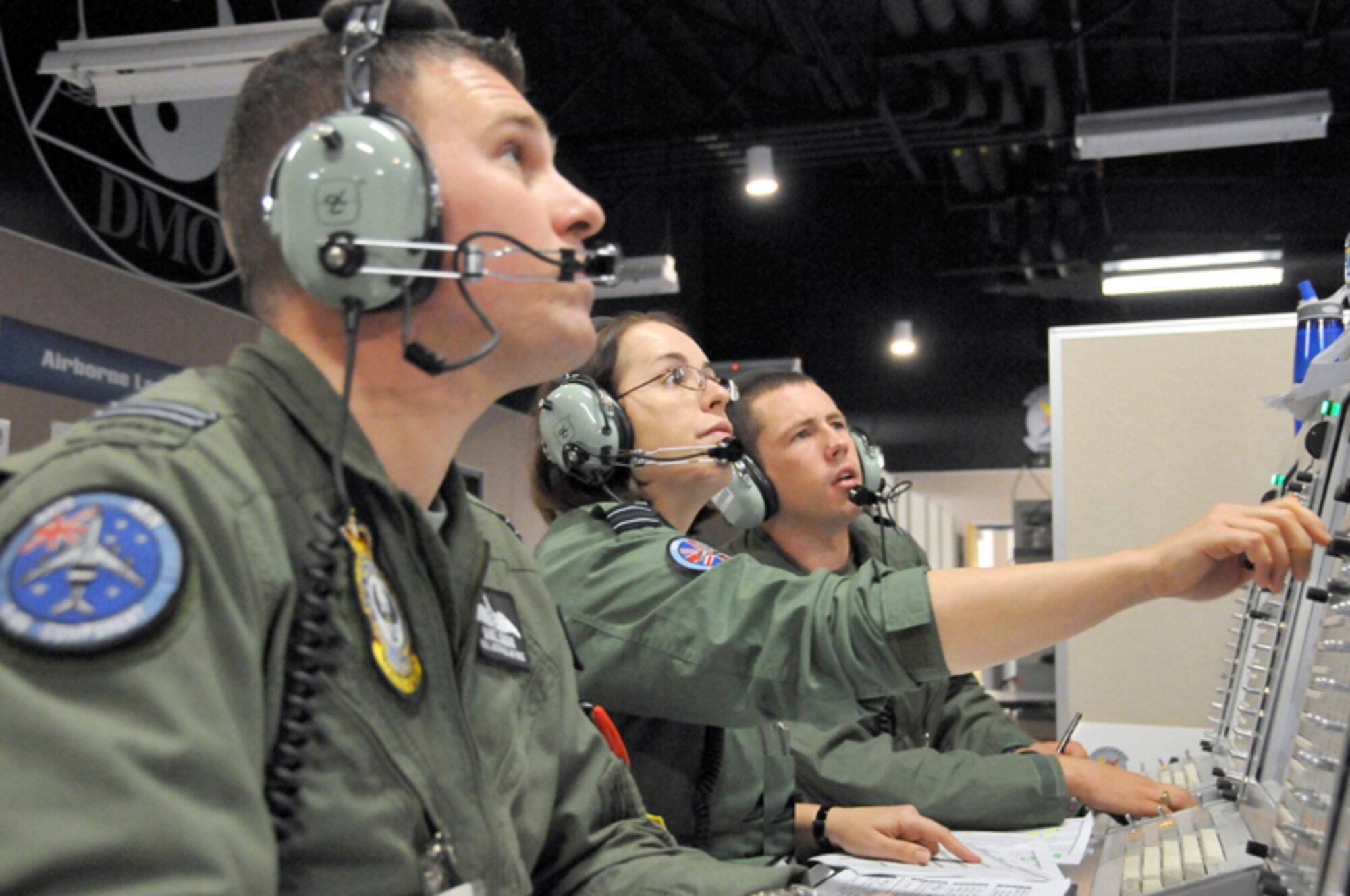 KIRTLAND AIR FORCE BASE, N.M. -- Airmen from the Royal Air Force participate in Coalition Virtual Flag on Sept. 23 at the Distributed Mission Operations Center. This U.K. crew was working on an AWACS simulator during the exercise as another unit at RAF Waddinton, U.K., flew another AWACS sim. This was the first Virtual Flag exercise that integrated simulators from the four their home countries. (Air Force photo by Ken Moore)