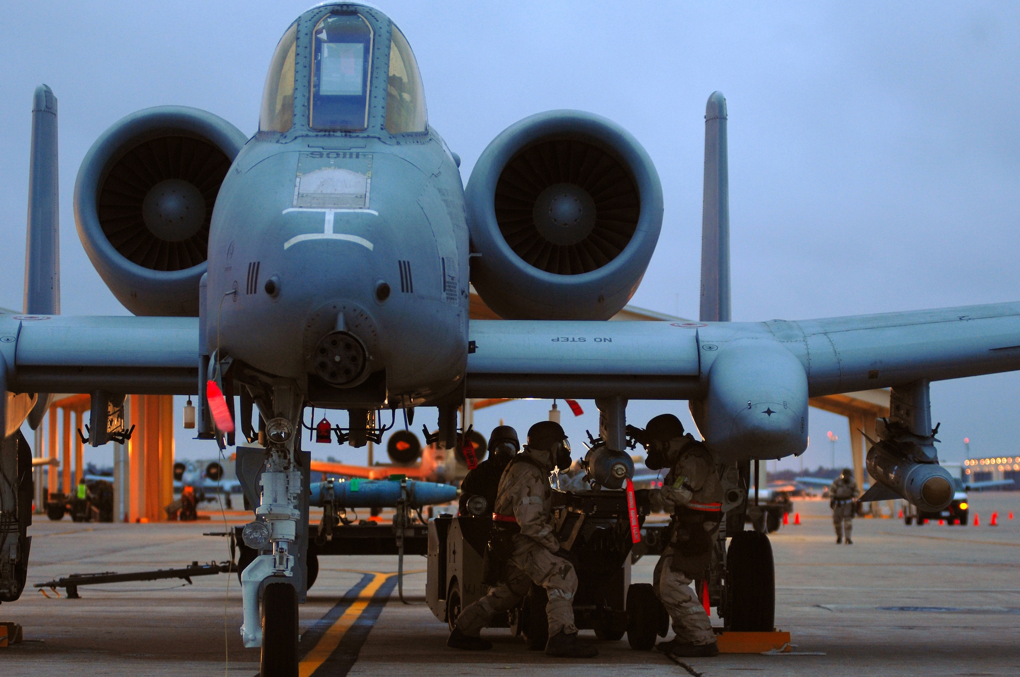 WHITEMAN AIR FORCE BASE, Mo. - (from left) Senior Airmen Neal Brent, Eric McCollom and Master Sgt. Robert Holtshouser, 442nd Fighter Wing, work together to rapidly load munitions onto an A-10 Thunderbolt II during an Operational Readiness Inspection, Oct. 26. 442nd Fighter Wing personnel worked around the clock in cold and wet weather conditions during the four-day exercise. The ORI prepared Airmen for real-world deployment situations such as chemical and biological attacks and other scenarios. (U.S. Air Force photo/Senior Airman Kenny Holston)(Released) 