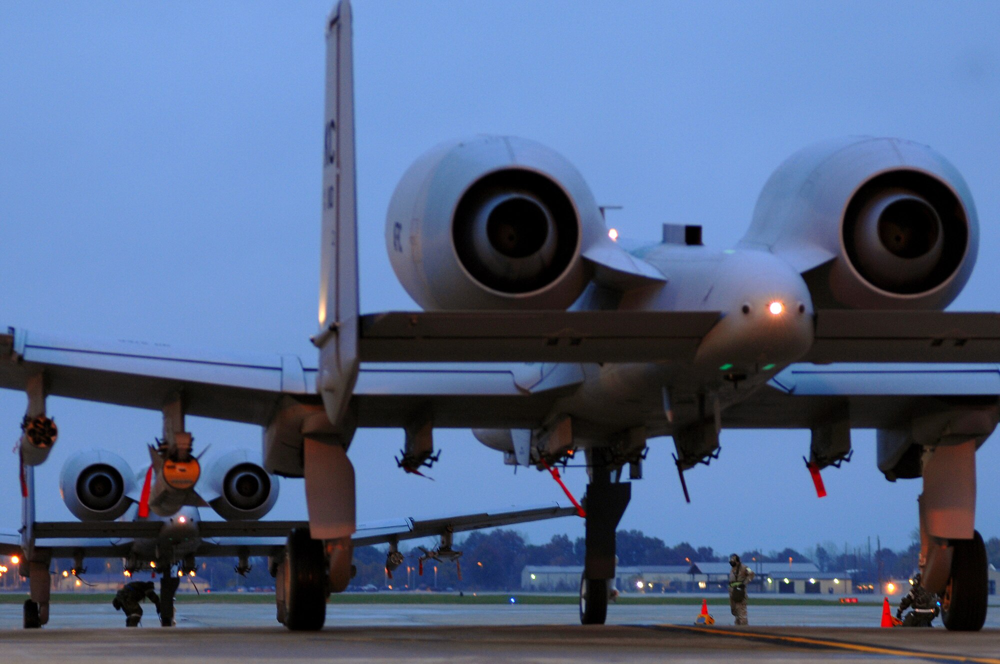 WHITEMAN AIR FORCE BASE, Mo. - A pair of A-10 Thunderbolt IIs assigned to the 442nd Fighter Wing, taxi into position for takeoff during an Operational Readiness Inspection, Oct. 26. 442nd FW personnel worked around the clock in cold and wet weather conditions during the four-day exercise. The ORI prepared Airmen for real-world deployment situations such as chemical and biological attacks and other scenarios. (U.S. Air Force photo/ Senior Airman Kenny Holston)(Released) 