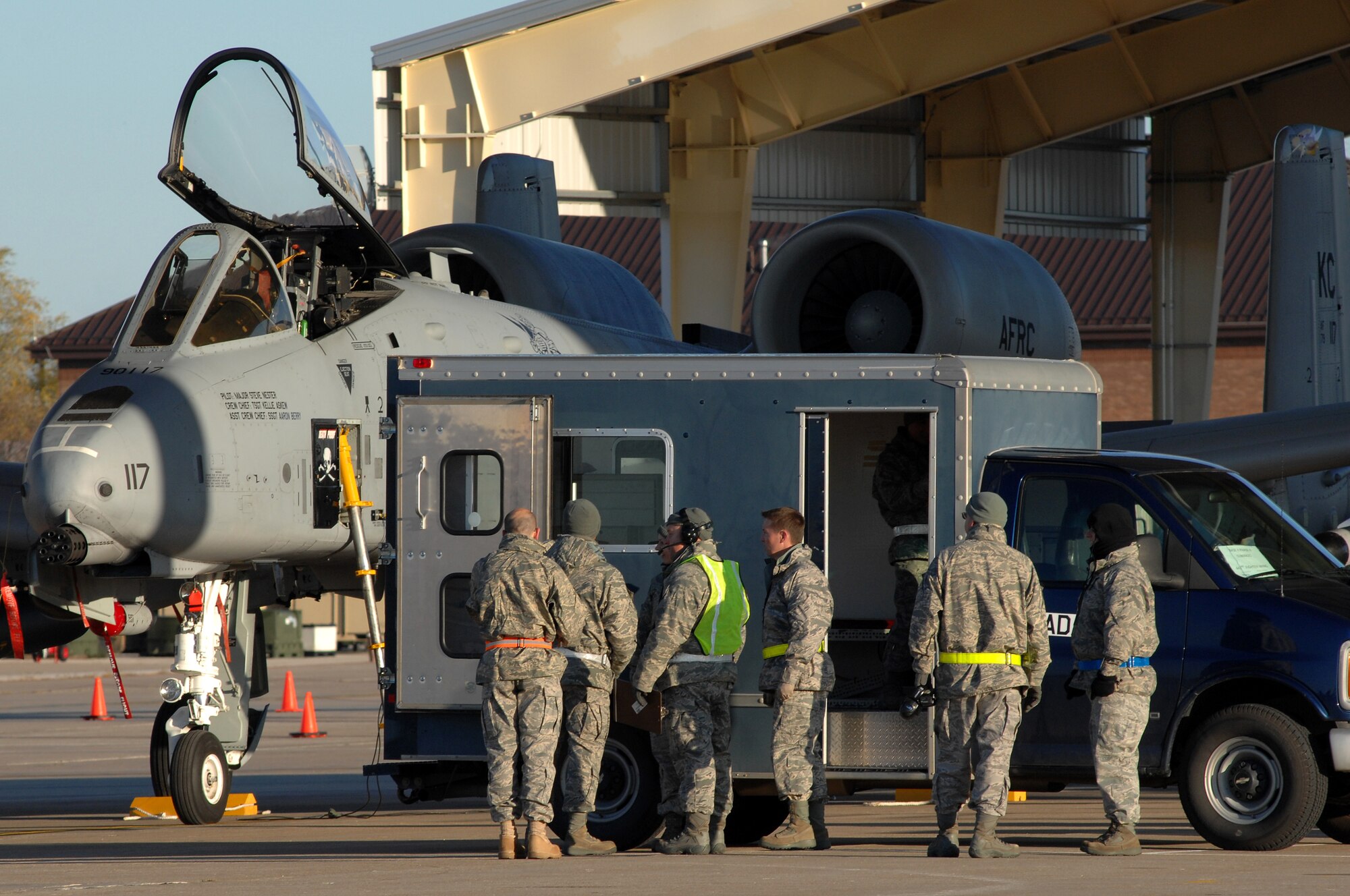 WHITEMAN AIR FORCE BASE, Mo. - Crew chiefs with the 442nd Fighter Wing gather around a maintenance truck to discuss their next move during an Operational Readiness Inspection, Oct. 24. 442nd FW personnel worked around the clock in cold and wet weather conditions during the four-day exercise. The ORI prepared Airmen for real-world deployment situations such as chemical and biological attacks and other scenarios. (U.S. Air Force photo/Senior Airman Kenny Holston)(Released) 