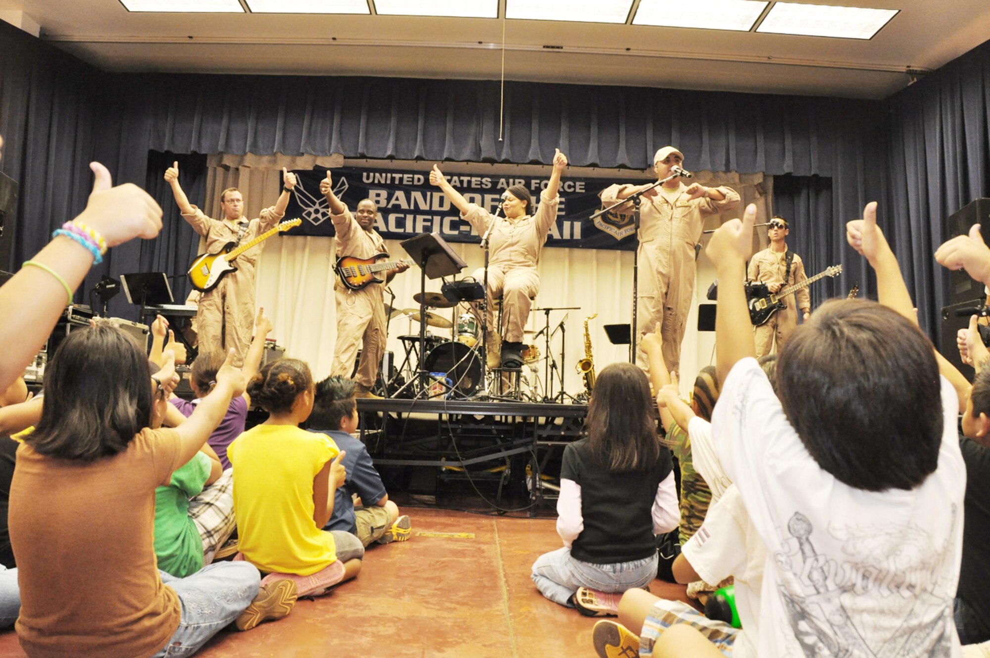 Band of the Pacific-Hawaii members perform at Kaleiopuu elementary School Oct. 22, 2009, in Waipahu, Hawaii. The band peformed as part of Red Ribbon Week that is aimed at reinforcing children's decisions to stay away from drugs and make positive decisions in life. (U.S. Air Force photo/Tech. Sgt. Cohen A. Young) 
