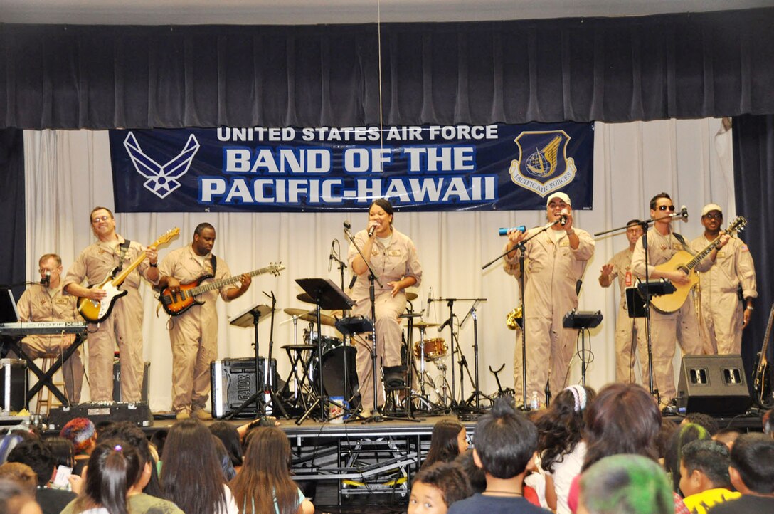 Band of the Pacific-Hawaii members perform at Kaleiopuu elementary School Oct. 22, 2009, in Waipahu, Hawaii. The band peformed as part of Red Ribbon Week that is aimed at reinforcing children's decisions to stay away from drugs and make positive decisions in life. (U.S. Air Force photo/Tech. Sgt. Cohen A. Young) 

