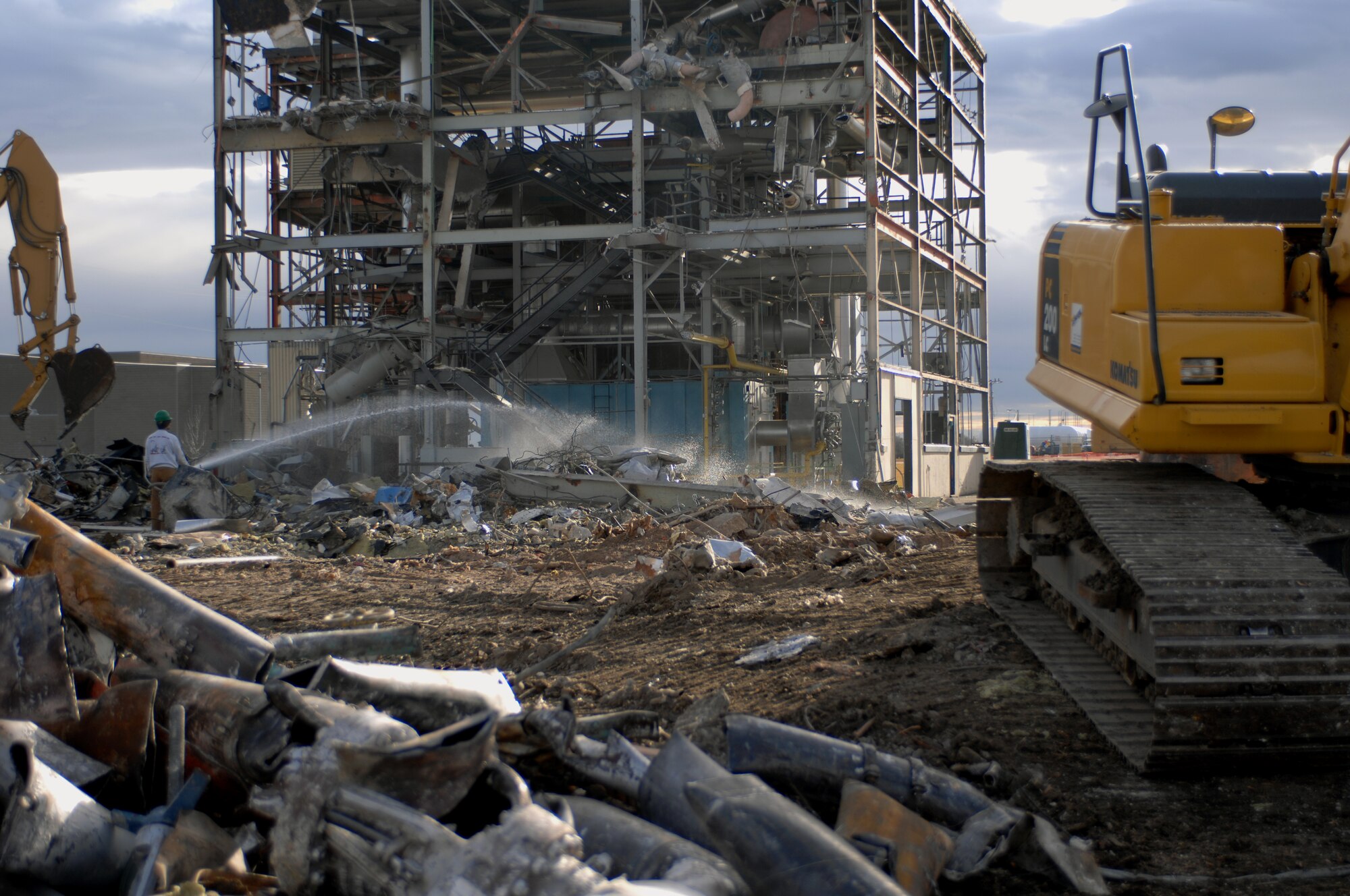 MINOT AIR FORCE BASE, N.D. -- Contractors demolish the heat plant, which served Minot AFB for more than 50 years, here, Oct. 27. The heat plant, built in 1957, first used coal to heat the base, which was later replaced by natural gas lines. Improvements like this are just one of the many ways this base is adhering to energy efficiency standards. (U.S. Air Force photo by Airman 1st Class Aaron-Forrest Wainwright)
