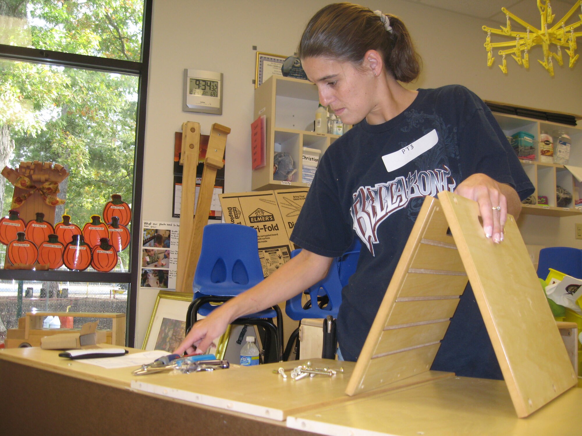 Debbie Bovankovich, 4th Fighter Wing Legal Office secretary, assembles a shelving unit at the Seymour Johnson Air Force Base Child Development Center as part of “Make a Difference Day” Oct. 24, 2009. Volunteers dedicated approximately 10 hours of labor to complete an array of renovation work at the CDC. (U.S. Air Force photo/Senior Airman Courtney Richardson)