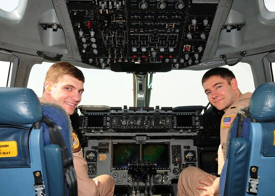 SOUTHWEST ASIA--(Right) 1st Lt. Rob Kurpiel, 817th Expeditionary Airlift Squadron C-17 Globemaster III pilot deployed from McChord Air Force Base, Wash., sits next to his older brother, Capt. Chris Kurpiel, C-17 pilot deployed from McGuire AFB, N.J. Captain Kurpiel arrived on station Oct. 24, 2009 with aircrew members slated to relieve Lieutenant Kurpiel and the rest of the current 817th EAS rotation. (U.S. Air Force photo/Tech. Sgt. Tony Tolley)