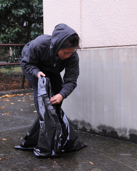 YOKOTA AIR BASE, Japan -- Senior Airman Prapaporn Wangsuttisomsri, 374th Medical Support Squadron, participates in Troops for Trash near Yuko Park on the base's east side Oct. 25. (U.S. Air Force photo/Airman 1st Class Michael Dillon)