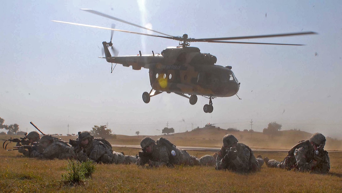 U.S. and Indian soldiers prepare to rendevous after exiting an M17 ...