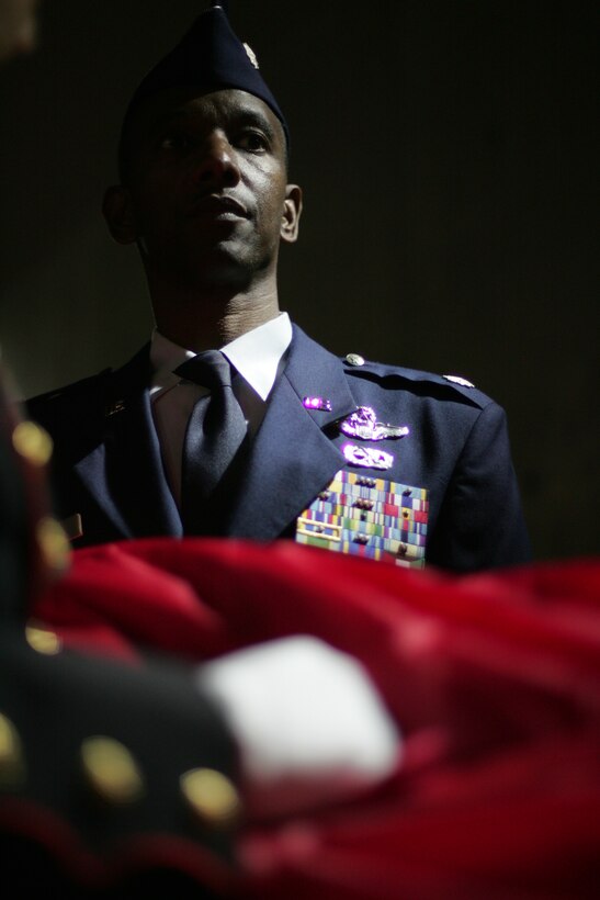 Air Force Lt. Col. Nathaniel Ward, C-17 pilot, 732 Airlift Squadron, McGuire Air Force Base, waits with the American Flag inside Yankee Stadium. The Snow Hill, Md., native was part of the Marine, soldier, sailor, airmen and West Point cadet detail that unfurled an American Flag before the first game of the World Series, Oct. 28.  The ceremony honored military veterans.(Official Marine Corps photo by Sgt. Randall A. Clinton)