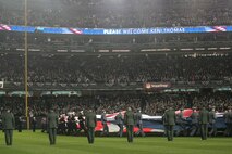Marines, sailors, airmen, soldiers and West Point cadets unfurl an outfield-sized American Flag across Yankee Stadium prior to the first game of the World Series, Oct 28, New York. The ceremony honored military veterans.(Official Marine Corps photo by Sgt. Randall A. Clinton)