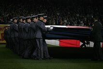 Marines, sailors, airmen, soldiers and West Point cadets unfurl an outfield-sized American Flag across Yankee Stadium prior to the first game of the World Series, Oct 28, New York. The ceremony honored military veterans.(Official Marine Corps photo by Sgt. Randall A. Clinton)
