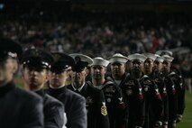 Marines, sailors, airmen, soldiers and West Point cadets march off the field after a pregame ceremony at Yankee Stadium, N.Y., Oct. 28. Service members unfurled a flag across the outfield, and wounded warriors joined a United States Military Academy at West Point color guard prior to the first game of the World Series. The ceremony honored military veterans.(Official Marine Corps photo by Sgt. Randall A. Clinton)