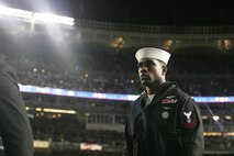 Marines, sailors, airmen, soldiers and West Point cadets march off the field after a pregame ceremony at Yankee Stadium, N.Y., Oct. 28. Service members unfurled a flag across the outfield, and wounded warriors joined a United States Military Academy at West Point color guard prior to the first game of the World Series. The ceremony honored military veterans. (Official Marine Corps photo by Sgt. Randall A. Clinton)