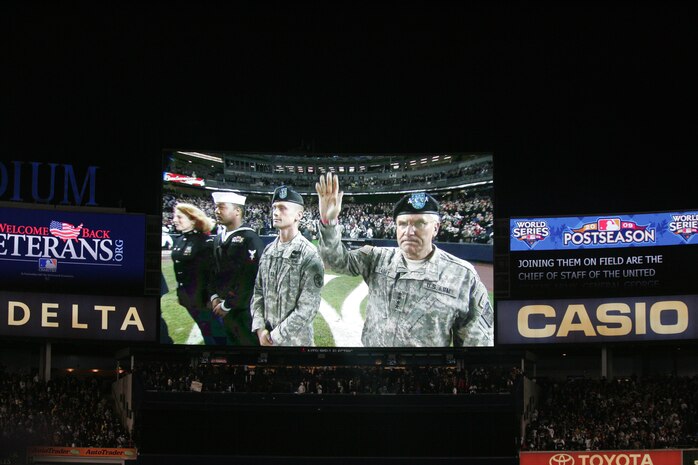 Gen. George W. Casey Jr., Chief of Staff for the U.S. Army, acknowledges the crowd during an on field celebration honoring military veterans during the 7th inning stretch of the first game of the World Series Oct. 28, New York. (Official Marine Corps photo by Sgt. Randall A. Clinton)
