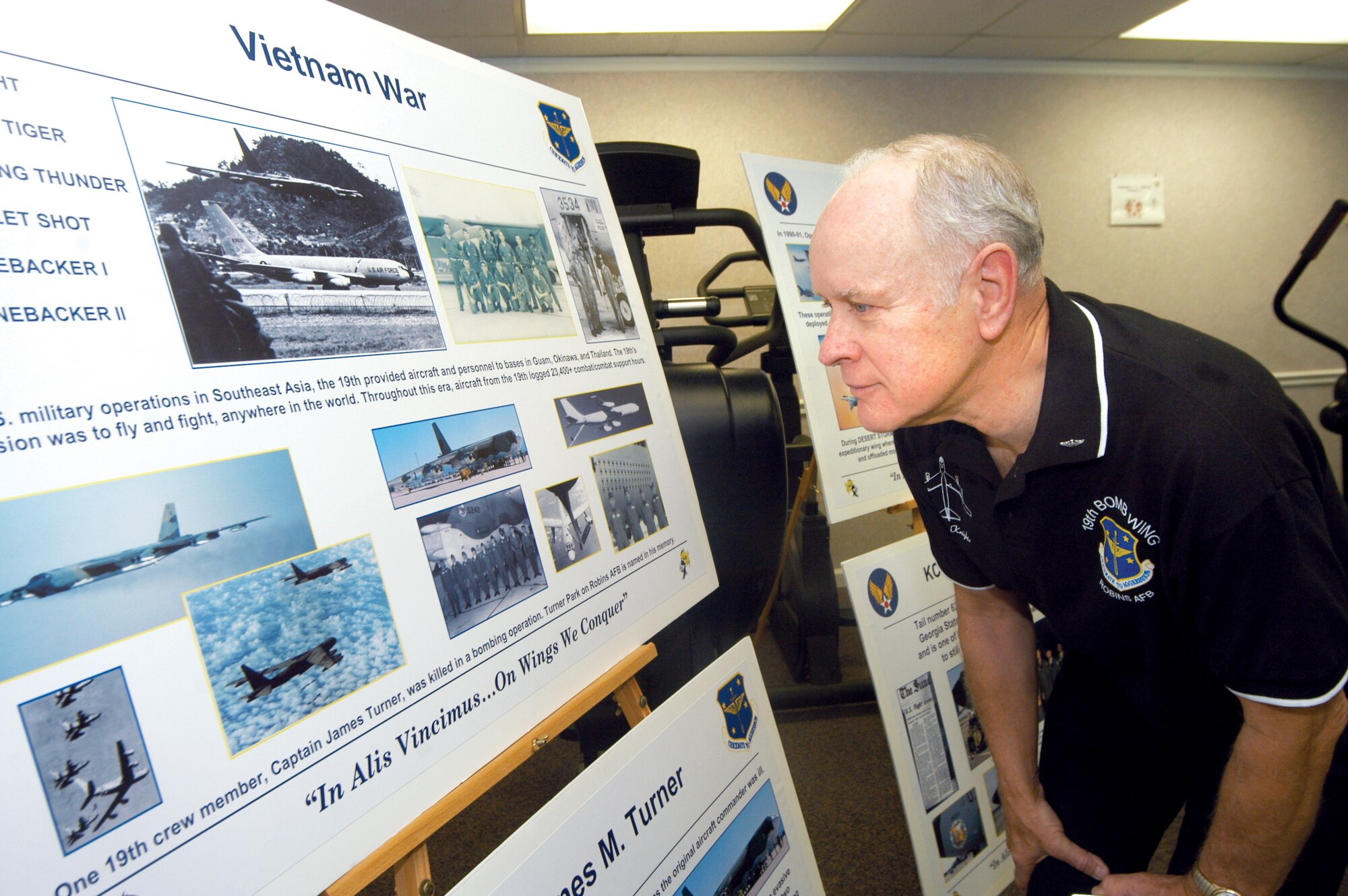 Rick Jones, a former B-52 pilot who was stationed at Robins from 1971-1975, looks at the displays at the open house Friday. U. S. Air Force photo by Sue Sapp  




 


