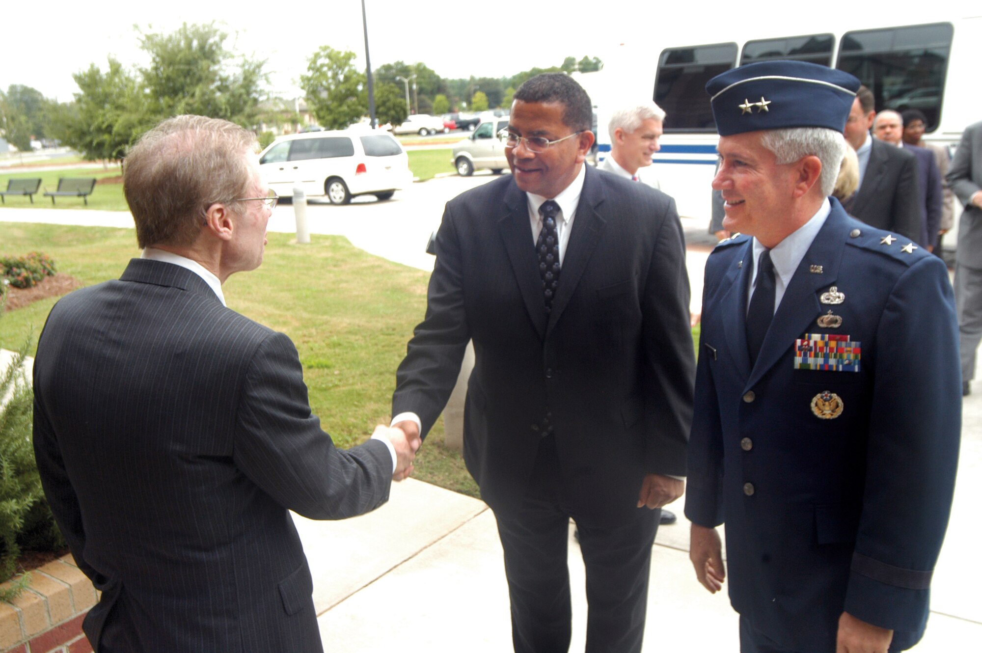 David Bell, Macon State College president, greets Frank Anderson, Defense Acquisition University president,and Maj. Gen. Tom Owen, Warner Robins Air Logistics Center commander at Macon State College where a partnership agreement was signed to promote workforce development.  U. S. Air Force photo by Sue Sapp 