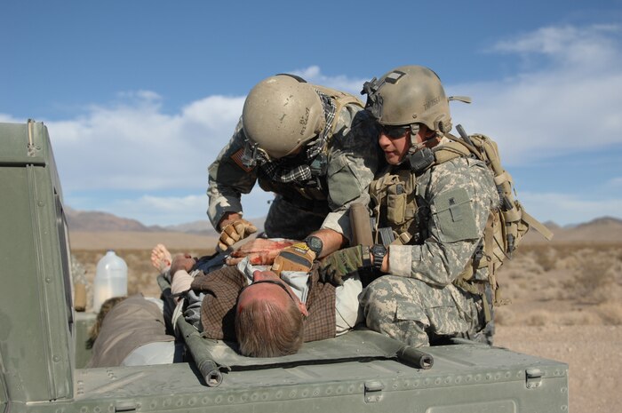 NEVADA TEST AND TRAINING RANGE, Nev. -- U.S. Army Special Forces Soldiers prepare a simulated wounded victim for evacuation from a simulated roadside bomb at the Urban Operations Center on the Nevada Test and Training Range, Oct. 21, 2009. Special Forces Units from all branches of service and allied nations use the facilities on the NTTR for a multitude of different training. (U.S. Air Force photo by Airman 1st Class Brett Clashman/Released)