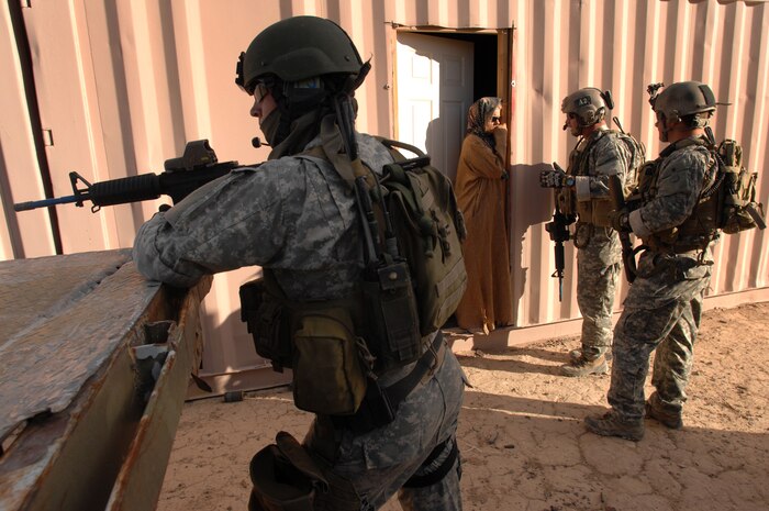 NEVADA TEST and TRAINING RANGE, Nev. -- U.S. Special Forces soldiers search for the daughter of a village elder from a simulated hostage situation during a training scenario at the Urban Operations Center on the Nevada Test and Training Range, Oct. 21, 2009. Special Forces Units from all branches of service and allied nations use the facilities on the NTTR for a multitude of different training.  (U.S. Air Force photo by Tech. Sgt. Michael R. Holzworth)(released)