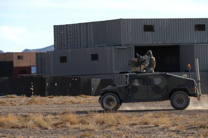 NEVADA TEST and TRAINING RANGE, Nev. -- U.S. Special Forces Soldiers patrol a village during a training exercise at the Urban Operations Center on the Nevada and Test Training Range, Oct. 21, 2009. Special Forces Units from all branches of service and allied nations use the facilities on the NTTR for a multitude of different training.  (U.S. Air Force photo by Tech. Sgt. Michael R. Holzworth)(released)
