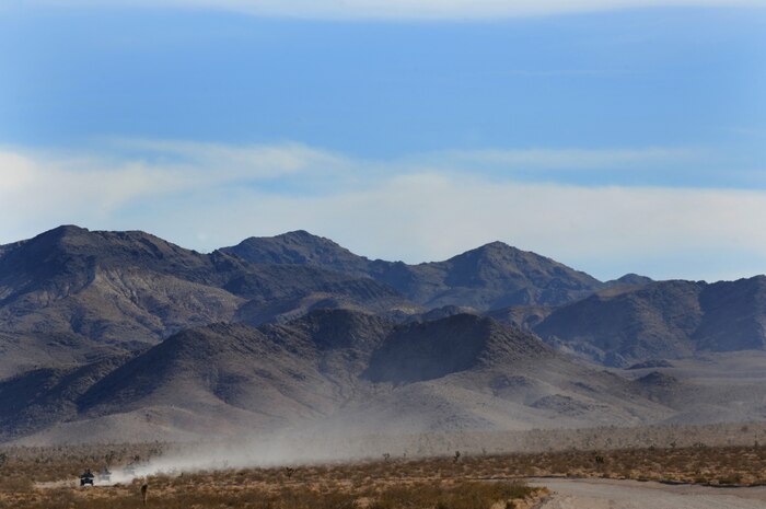 NEVADA TEST and TRAINING RANGE, Nev. -- U.S. Special Forces Soldiers and Airmen leave a trail of dust as they drive toward the Urban Operations Center on the Nevada Test and Training Range, Oct. 21, 2009. Special Forces Units from all branches of service and allied nations use the facilities on the NTTR for a multitude of different training.  (U.S. Air Force photo by Tech. Sgt. Michael R. Holzworth)(released)