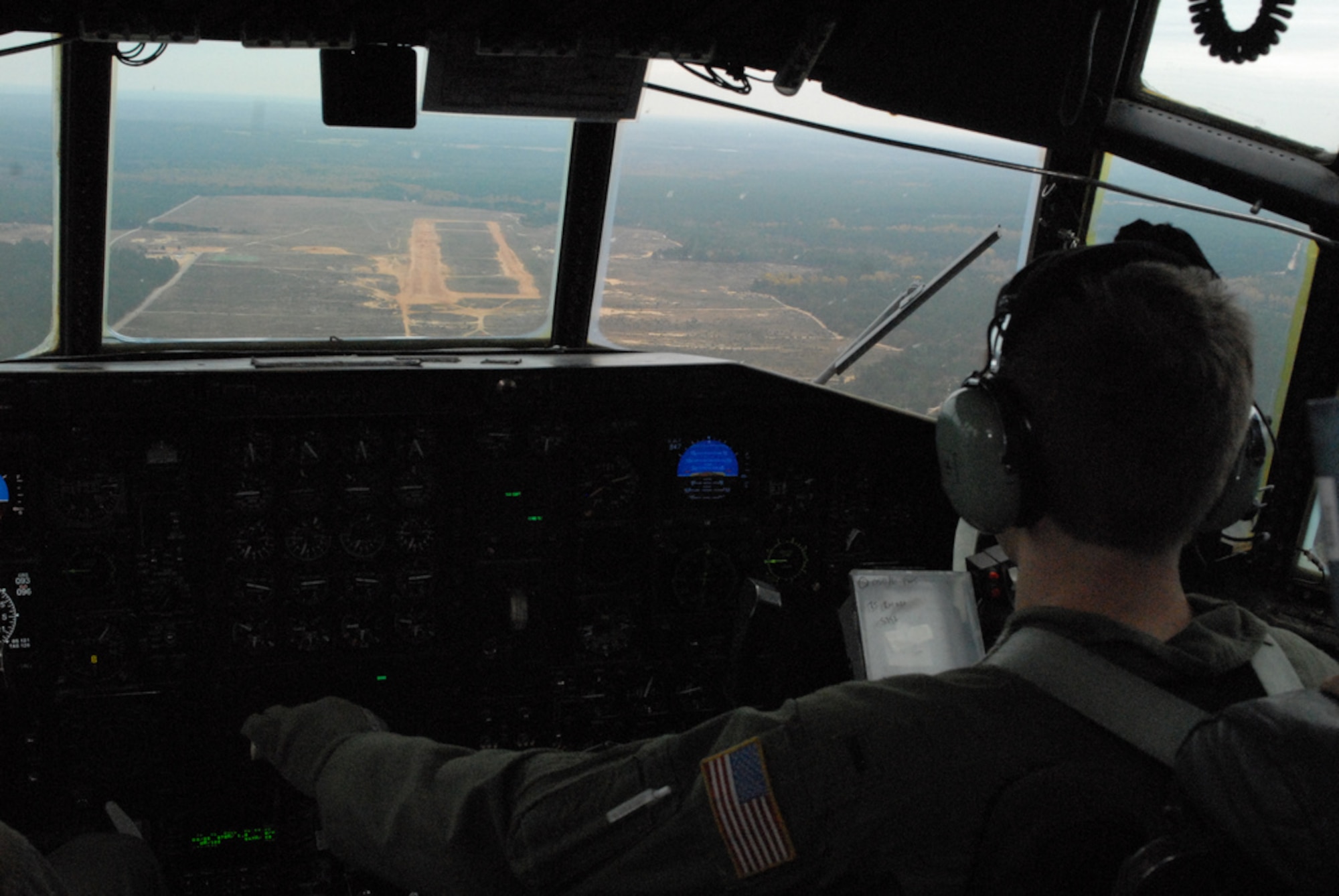 1st Lt. Jay Deas, 50th Airlift Squadron pilot, flies over the "Sicily" drop zone Oct. 27 as part of a joint force exercise at Pope AFB, N.C. The JFEX focused on cohesive training between the Air Force and Army to reestablish forcible entry capability through air power. (U.S. Air Force photo by Senior Airman Nathan Allen)