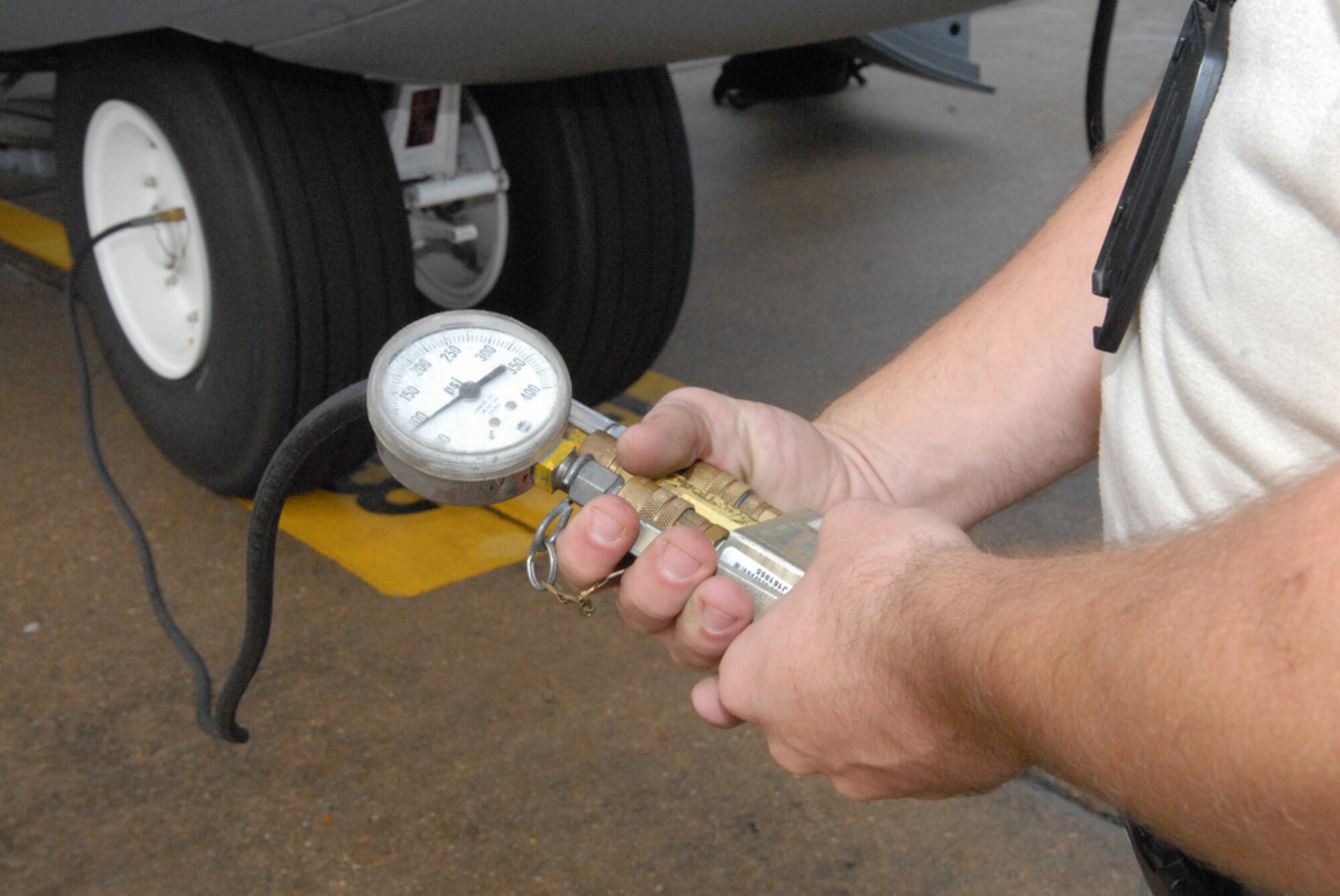 Staff Sgt. Bruce Jones, 19th Aircraft Maintenance Squadron crew chief from Little Rock Air Force Base, Ark., performs pre-flight tire service to the tire of a C-130J Oct. 28 as part of a joint force exercise at Pope AFB, N.C. The JFEX focused on cohesive training between the Air Force and Army to reestablish forcible entry capability through air power. (U.S. Air Force photo by Senior Airman Nathan Allen)