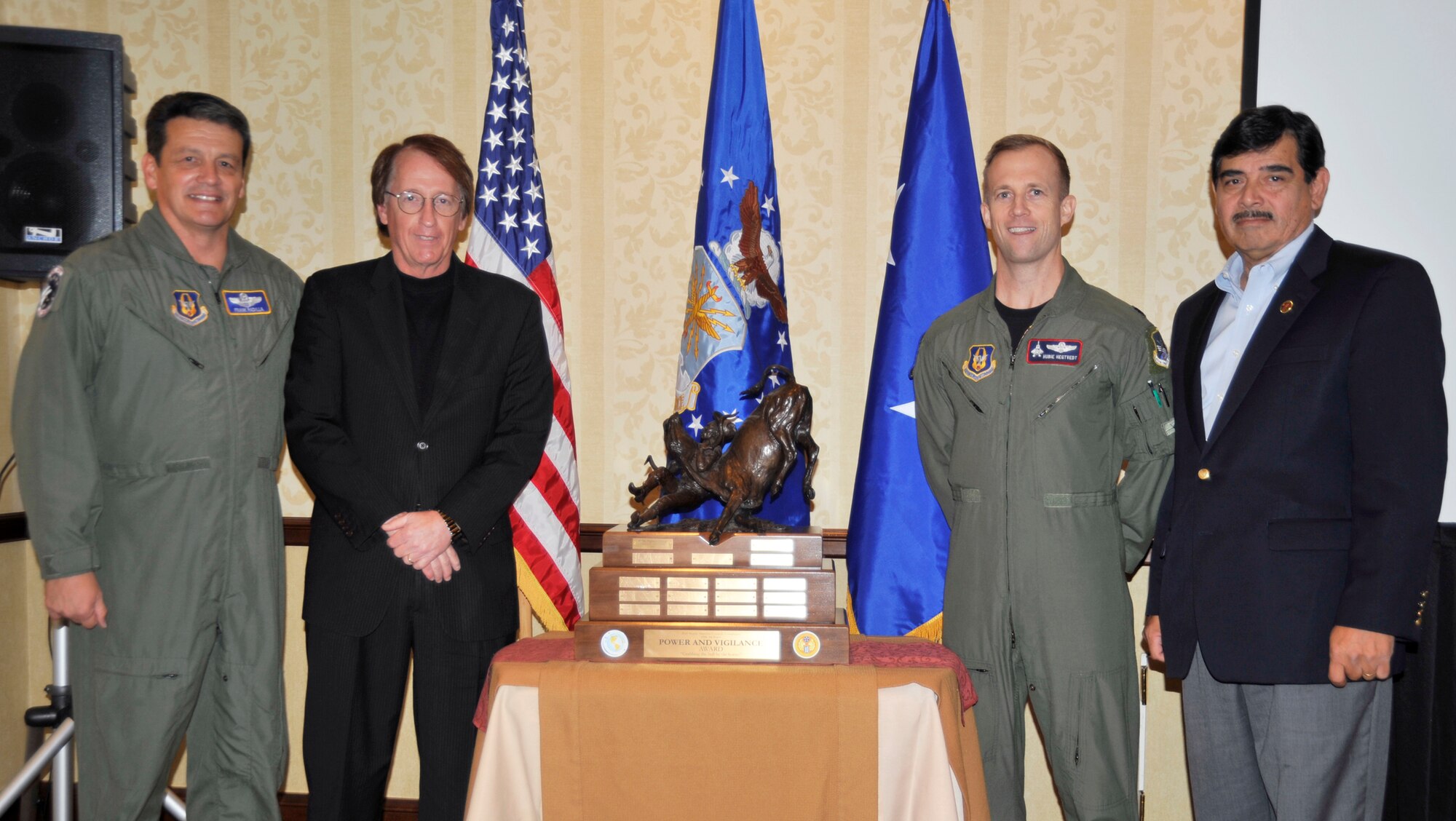 Maj. Gen. Frank Padilla, 10th Air Force commander, and members of the Fort Worth Air Power Council/Foundation present the Power and Vigilance award to Lt. Col. Hubie Hegtvedt, 302nd Fighter Squadron commander, who accepted the award on behalf of the 477th Fighter Group.  The 477th FG took ?the bull by the horns? and proclaimed top unit honors for all of Tenth Air Force.  This award, sponsored by the Fort Worth Air Power Council/Foundation, was created to honor those who go above and beyond just getting the job done.  (U.S. Air Force Photo)
