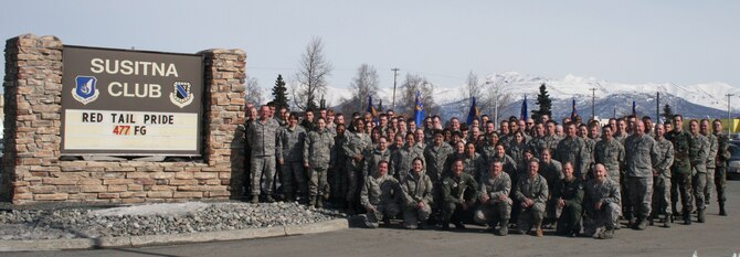 Members of the 477th Fighter Group from Elmendorf Air Force Base, Alaska.  The group won the Power and Vigilance Award recognizing them as the top unit in all of Tenth Air Force.  This is substantial recognition for the small group who competed against much larger and more established wings for the honor. During the award period, Reserve Airmen from the 477th filled key positions in the active duty structure, planned F-22 deployments and participated in multiple intercepts of Russian bomber aircraft. (U.S. Air Force Photo)