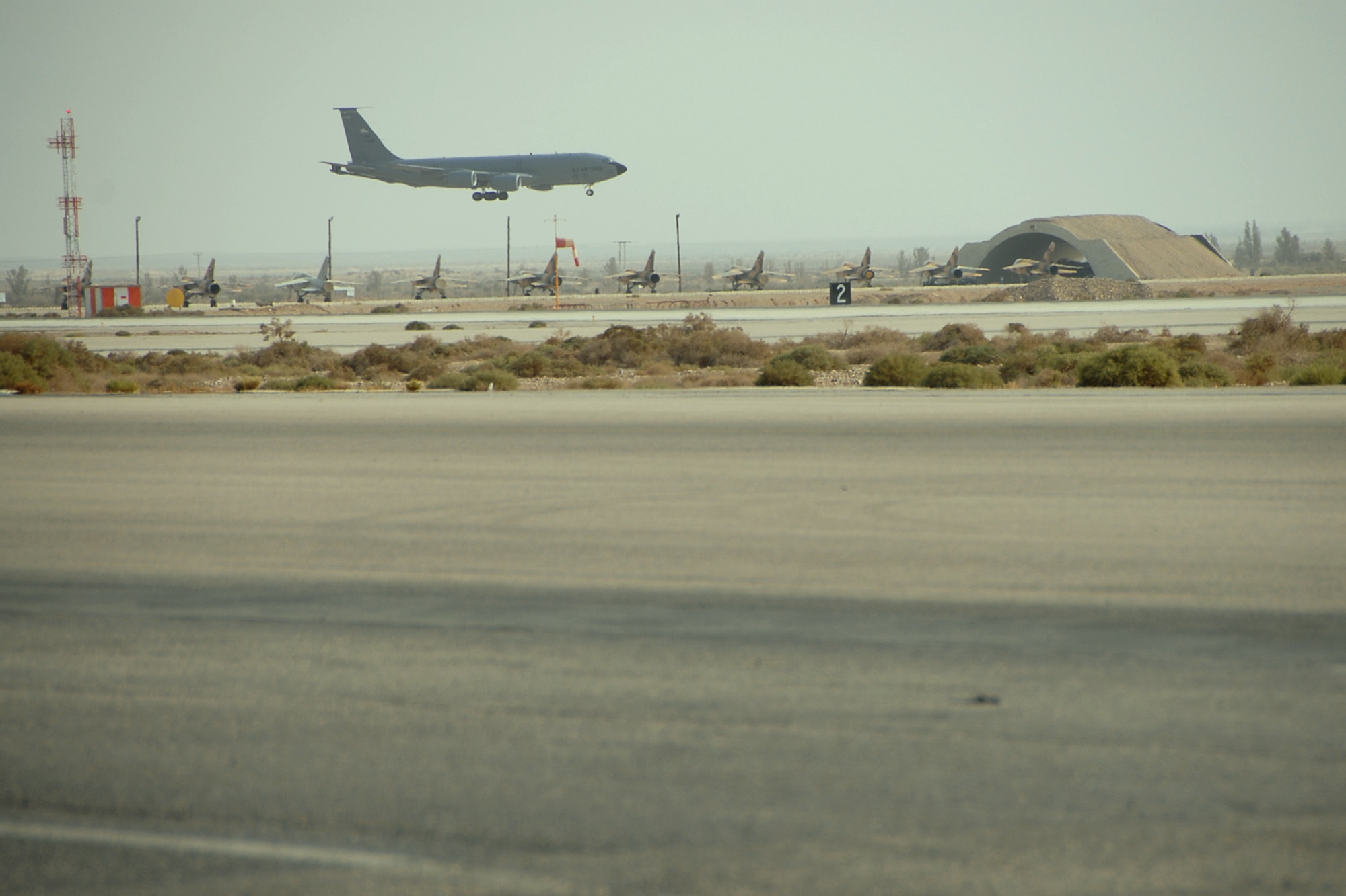 A U.S. Air Force KC-135 Stratotanker from McConnell Air Force Base, Kan., prepares to land at Mwaffaq Salti Air Base in Al Azraq, Jordan, on Oct. 17, 2009. The tanker accompanied six U.S. Air Force F-16 Fighting Falcon jets from the 169th Fighter Wing, South Carolina Air National Guard. The unit took part in Falcon Air Meet 2009, a multinational F-16 competition. The meet was inspired by Prince Feisal Bin Al Hussein and first organized in 2006. A main goal of the competition is the improvement of relationships between Jordan and partner nations and the promotion of stability in the region. (U.S. Air Force Photo/Tech. Sgt. Caycee Cook)  