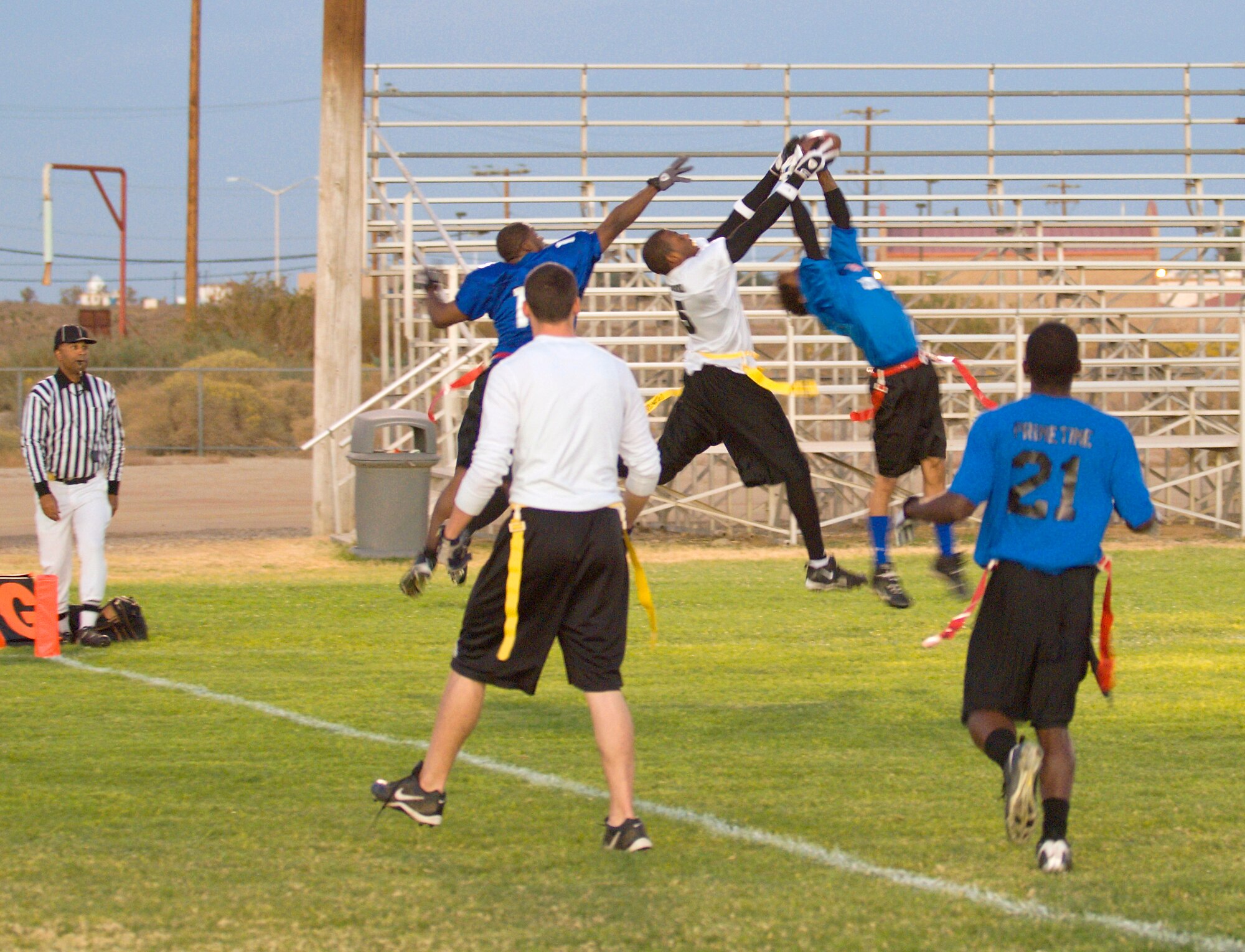 Players from the 95th Security Forces Squadron and 95th Medical Group fight for a pass during the Intramural Football Championship Oct. 26. The 95th SFS won 25-21 and 12-7. (Air Force photo/Mike Cassidy)