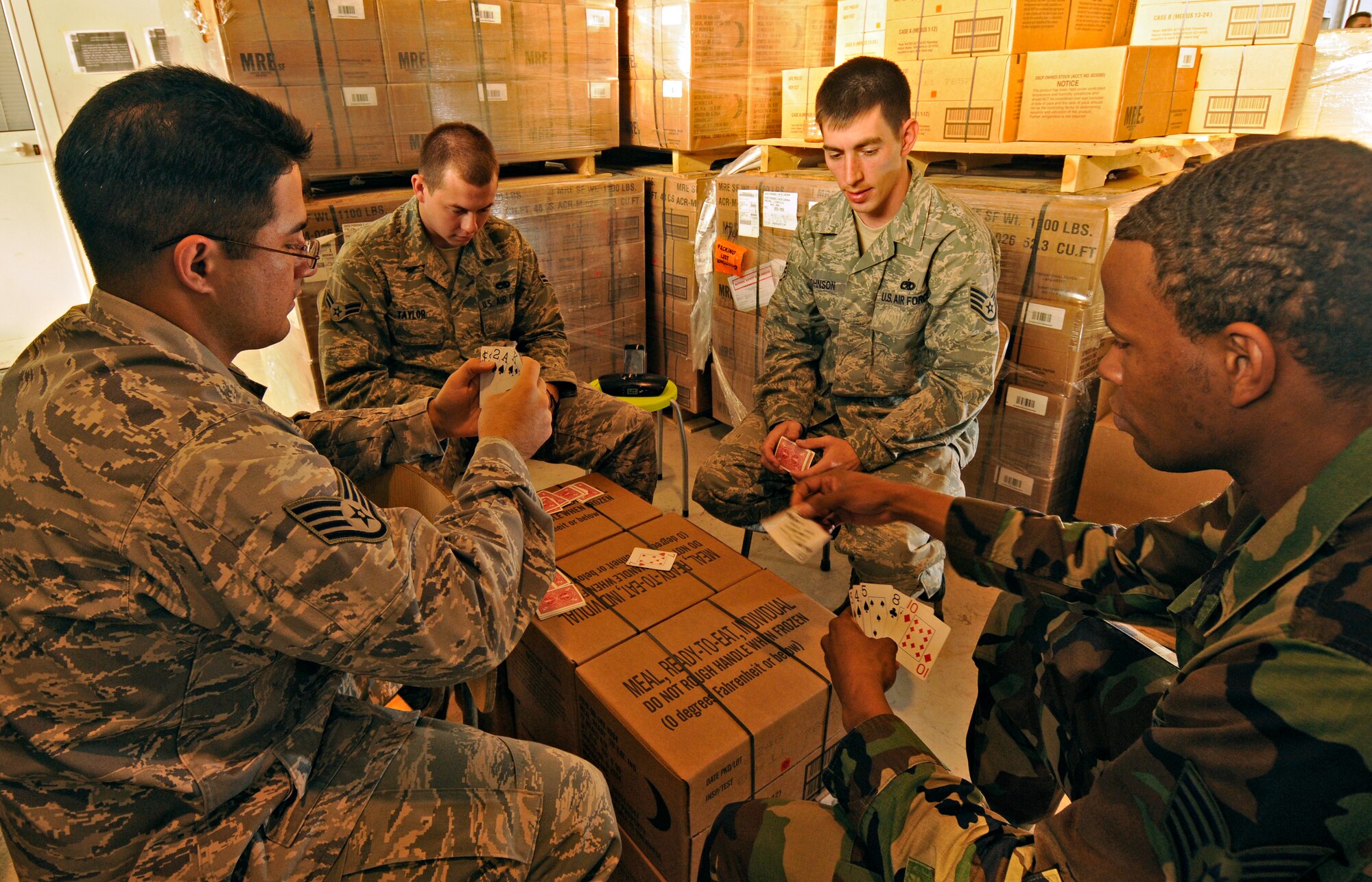 CAMPIA TURZII, Romania – A group of Airmen deployed from Spandahlem Air Base, Germany in support of Operation Dacian Thunder 2009 play a game of spades during some down time Oct. 26. During the operation the U.S. Air Force flew about 100 sorties; half of which were with the Romanian air force. (U.S. Air Force photo/Senior Airman Benjamin Wilson)