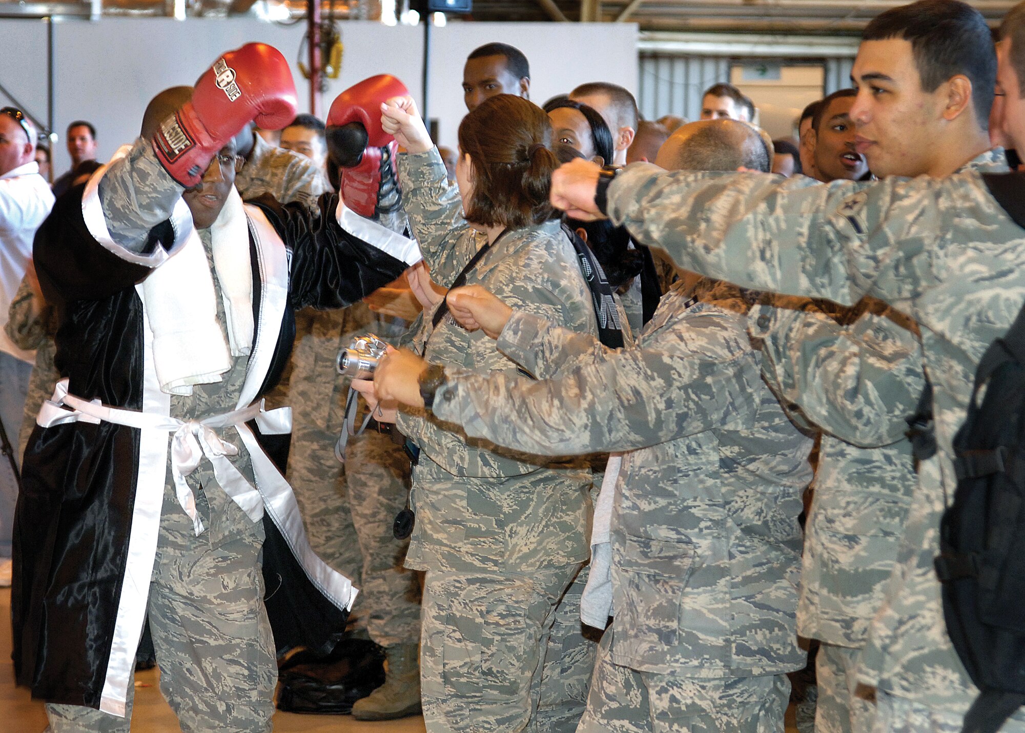 Col. Allen Jamerson, 72nd Air Base Wing and Tinker installation commander, high-fives Airmen as he enters the Pre-ORI rally. (Air Force photo by Margo Wright)