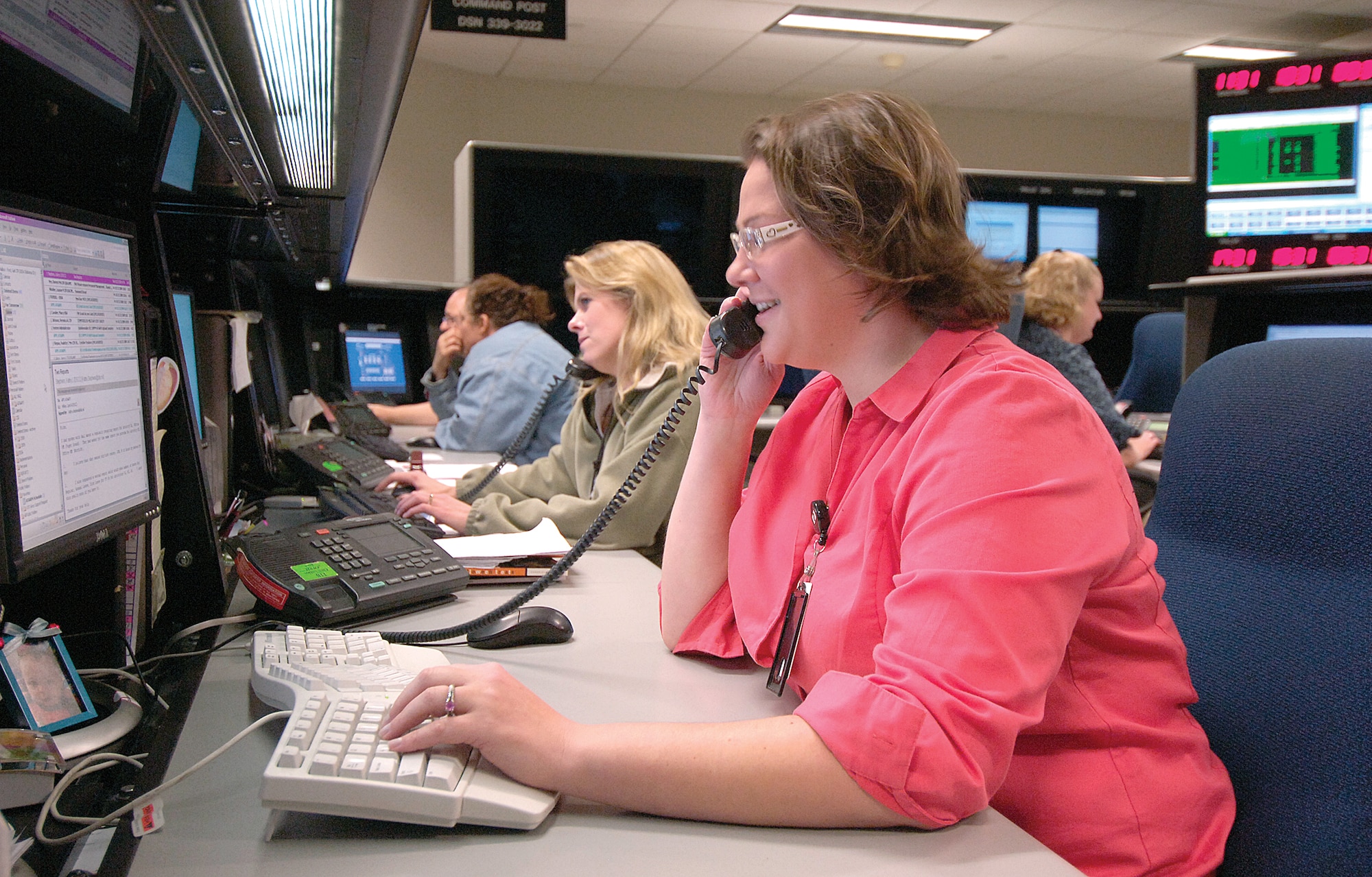 DISA systems administrator Gail Ford and other computer professionals help customers with computer problems around the world. (Air Force photo by Margo Wright)