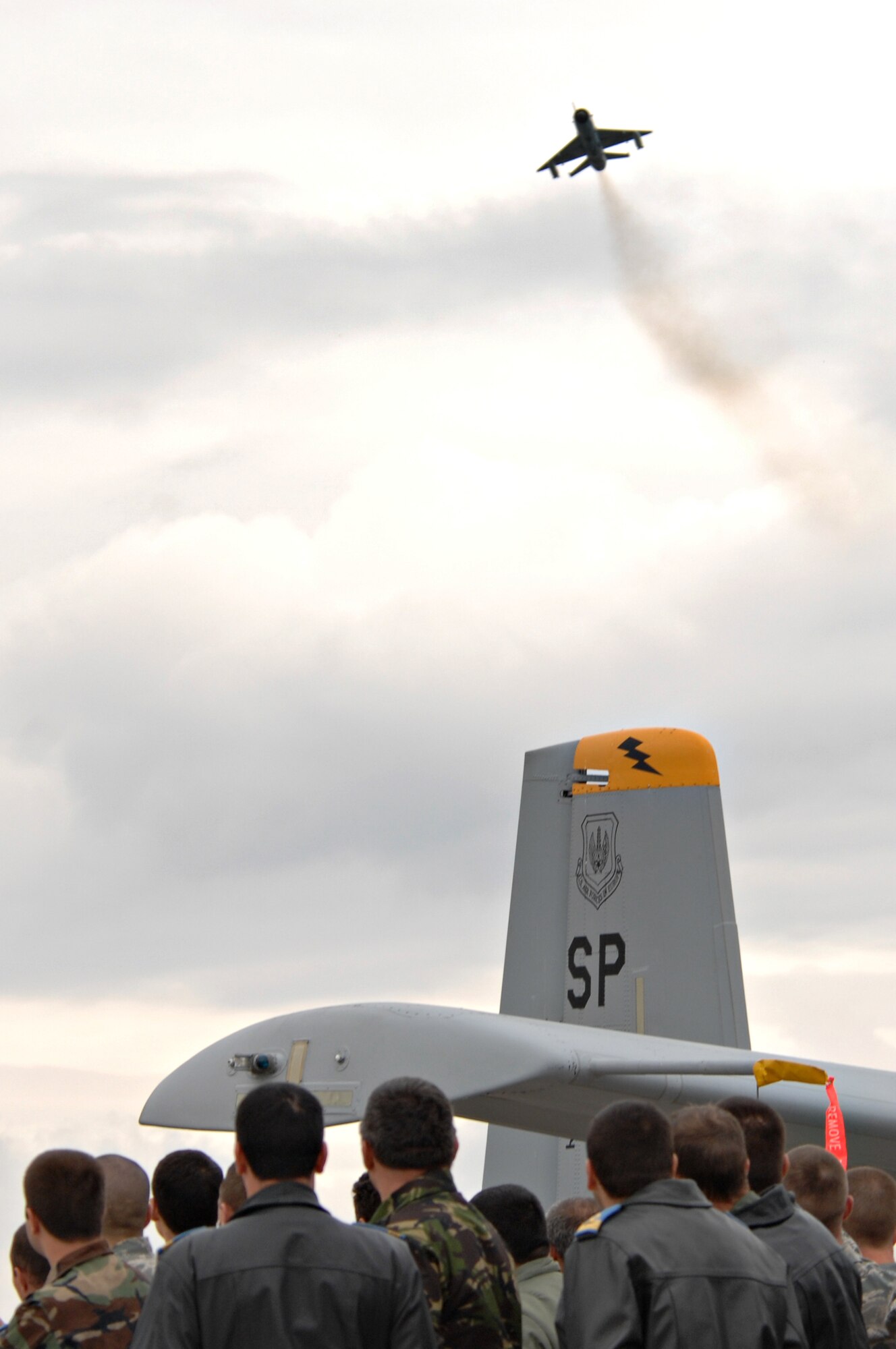CAMPI TURZII, Romania – A MIG 21 soars over a crowd of American and Romanian spectators standing next to an A-10 Thunderbolt II on the 71st Air Base Wing, in Romania, during an aerial demonstration as part of Operation Dacian Thunder 2009, Oct. 26. During the operation the U.S. Air Force flew about 100 sorties; half of which were with the Romanian air force. (U.S. Air Force photo/Senior Airman Benjamin Wilson).