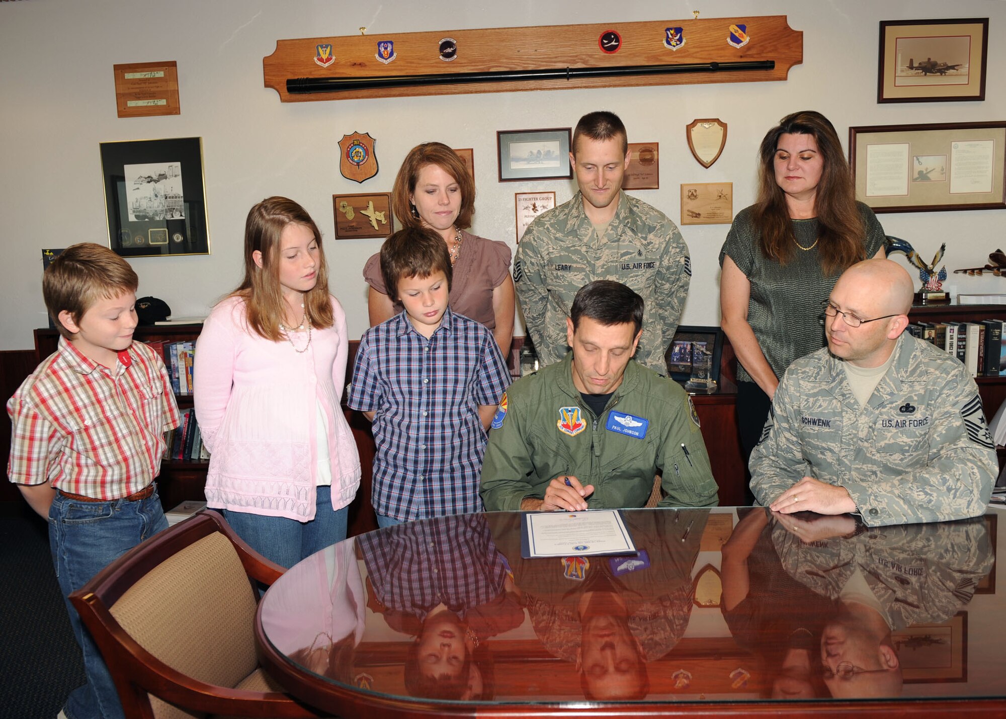 Brig. Gen. Paul Johnson, 355th Fighter Wing commander, reads the Air Force family week proclamation here Oct. 22 as the Leary family watches. The proclamation designated Nov.1 through Nov. 7 Davis-Monthan Air Force Base's Family Week. Many
activities are planned for Airmen and their families to participate in. The Secretary of the Air Force and Chief of Staff of the Air Force declared July 2009 to July 2010 as the "Year of the Air Force Family" and November is National Military Family Appreciation Month. (U.S. Air Force photo/Airman 1st Class Brittany Dowdle)
