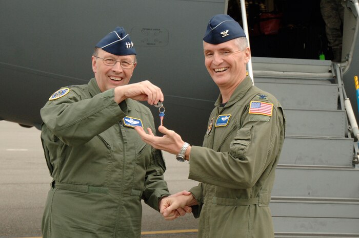 Lt. Gen. Charles Stenner Jr., left, hands Col. Steven Chapman, right, the keys to Charleston AFB's newest C-17 Oct. 28. An all reserve crew delivered  the C-17 bringing the total number of aircraft to 58. General Stenner is the commander of the Air Force Reserve Command and Colonel Chapman is the commander of the 315th Airlift Wing. (U.S. Air Force photo/Staff Sgt. Marie Brown)