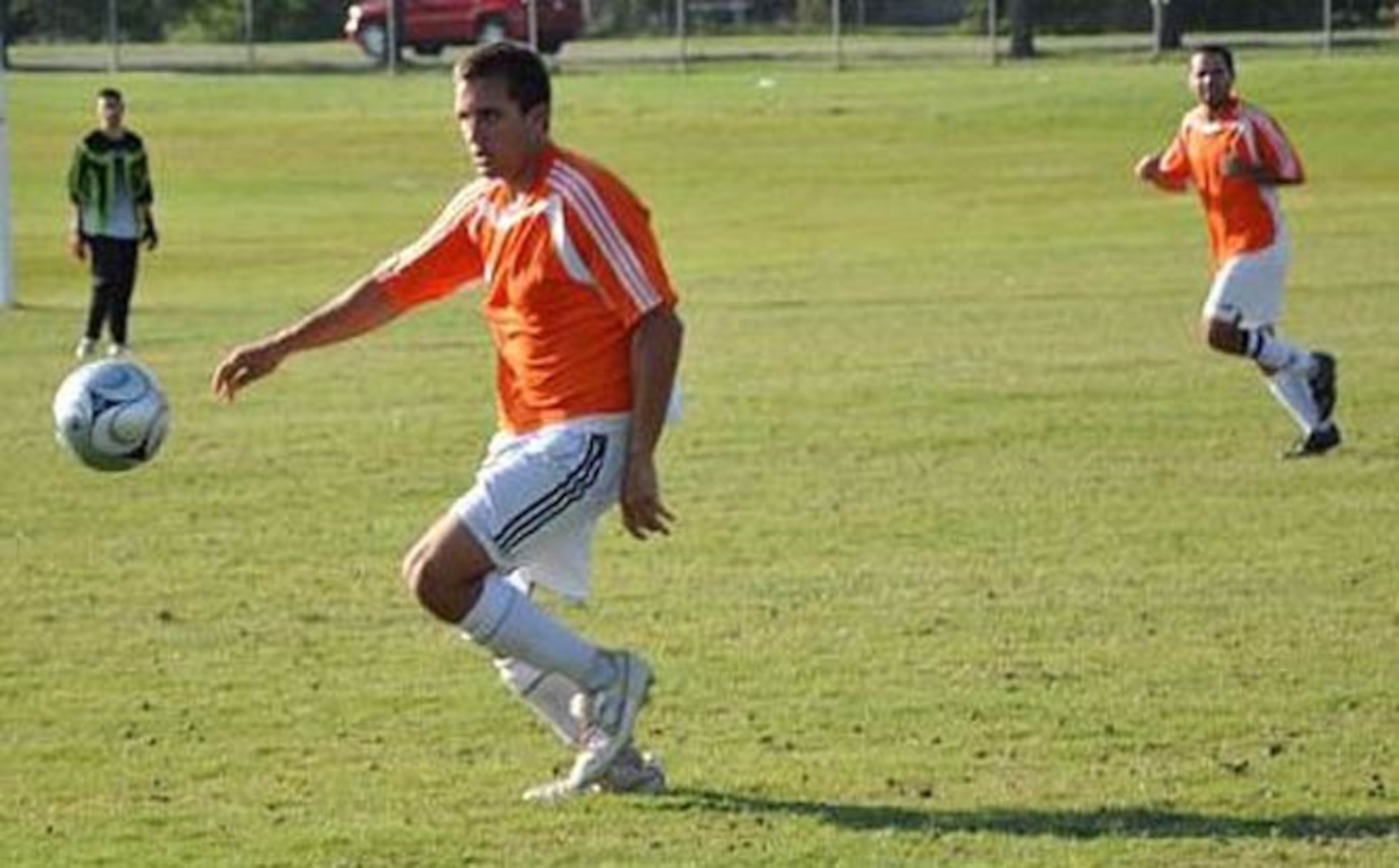 Tinker United Soccer Club player Justin Crawford, left, dribbles down field with teammate Jeremy Hinkle Oct. 25 during a match up against Pure Luck. Tinker tied 2-2 with the team, despite being down a red-carded player most of the game. Courtesy photo 