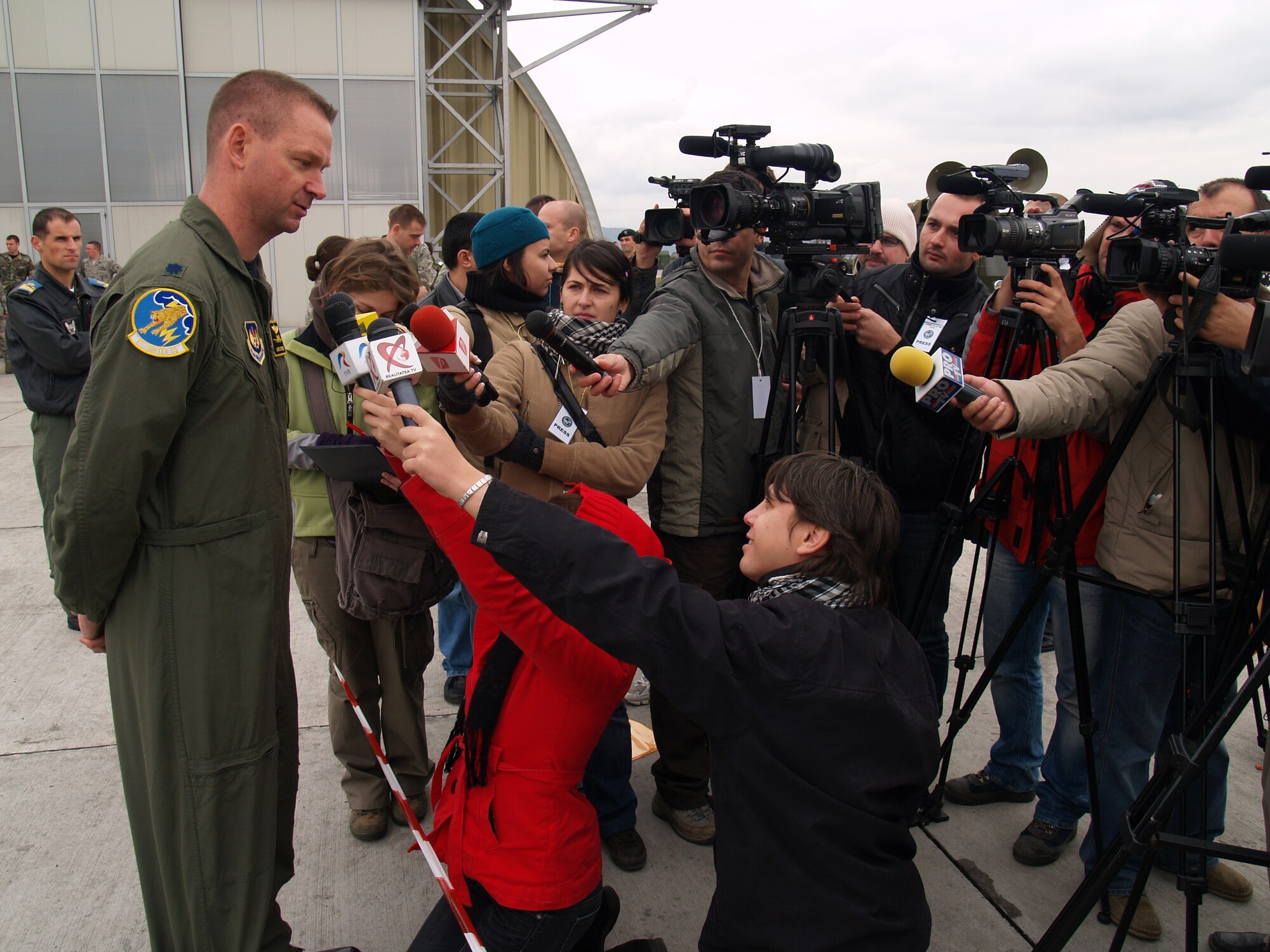 CAMPIA TURZII, Romania – Lt. Col. Ronald Steuwe, 81st Fighter Squadron commander, addresses question from the Romanian press after the last day of combined flying exercises in support of Operation Dacian Thunder. Gen. Roger Brady, U.S. Air Forces in Europe commander; Mark Gitenstein, U.S. Ambassador to Romania; and Maj. Gen. Ion-Aurel Stancui, Chief of Staff of the Romanian Air Force; visited the base and viewed an aerial demonstration during the operation. During the combined training exercise the U.S. Air Force flew about 100 sorties; half of which were flown with the Romanian air force. (U.S. Air Force photo/ Captain Greg Hignite)