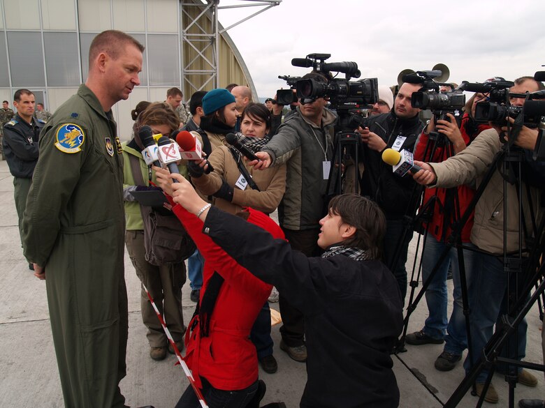 CAMPIA TURZII, Romania – Lt. Col. Ronald Steuwe, 81st Fighter Squadron commander, addresses question from the Romanian press after the last day of combined flying exercises in support of Operation Dacian Thunder. Gen. Roger Brady, U.S. Air Forces in Europe commander; Mark Gitenstein, U.S. Ambassador to Romania; and Maj. Gen. Ion-Aurel Stancui, Chief of Staff of the Romanian Air Force; visited the base and viewed an aerial demonstration during the operation. During the combined training exercise the U.S. Air Force flew about 100 sorties; half of which were flown with the Romanian air force. (U.S. Air Force photo/ Captain Greg Hignite)