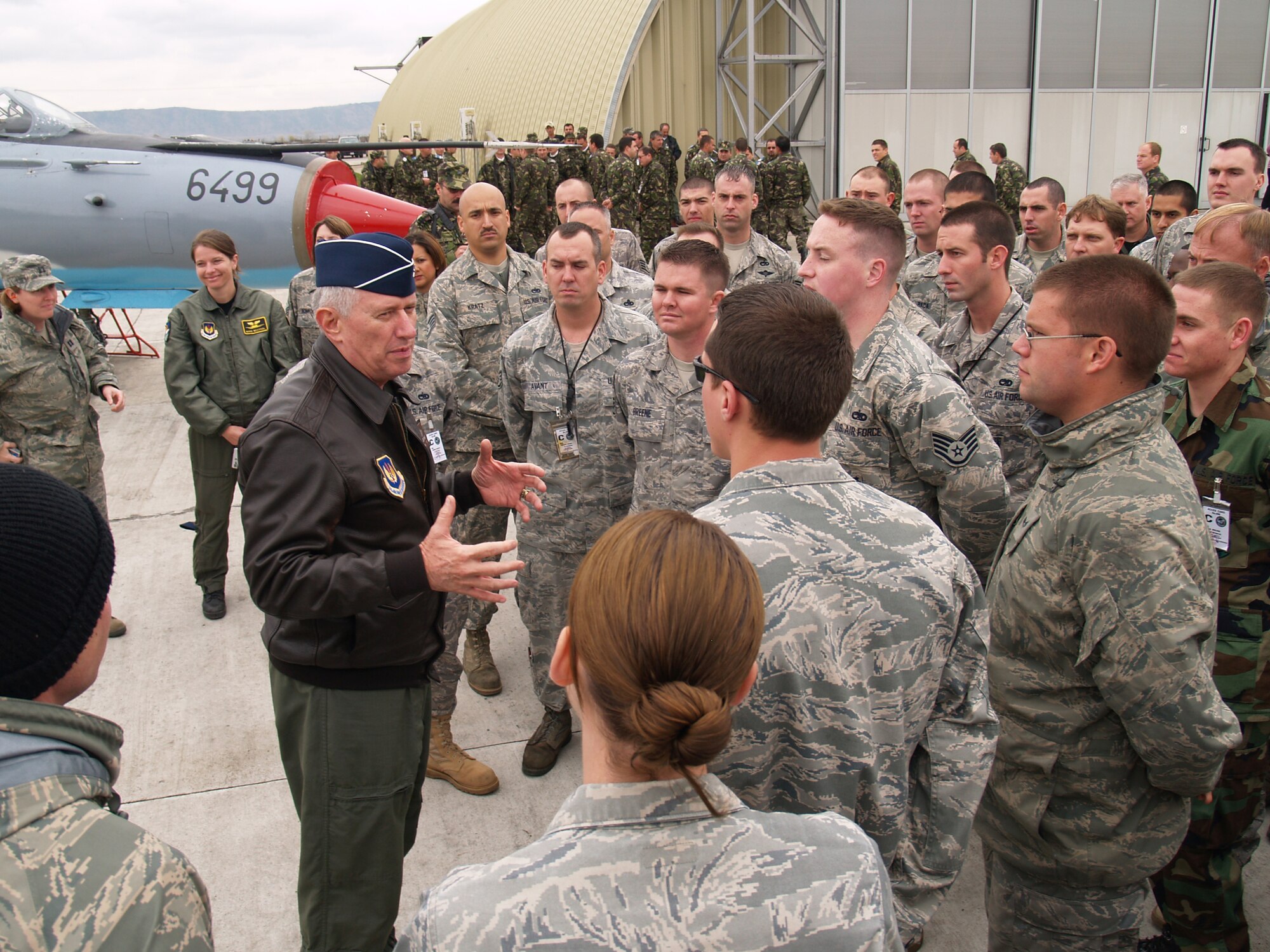 CAMPIA TURZII, Romania – Gen. Roger Brady, U.S. Air Forces in Europe commander, speaks to U.S. Airmen on the flightline of the 71st ABW in Romania Oct. 28. General Brady; Mark Gitenstein, U.S. Ambassador to Romania; and Maj. Gen. Ion-Aurel Stancui, Chief of Staff of the Romanian Air Force; visited the base during Operation Dacian Thunder. During the combined training exercise the U.S. Air Force flew about 100 sorties; half of which were flown with the Romanian air force. (U.S. Air Force photo/Captain Greg Hignite)