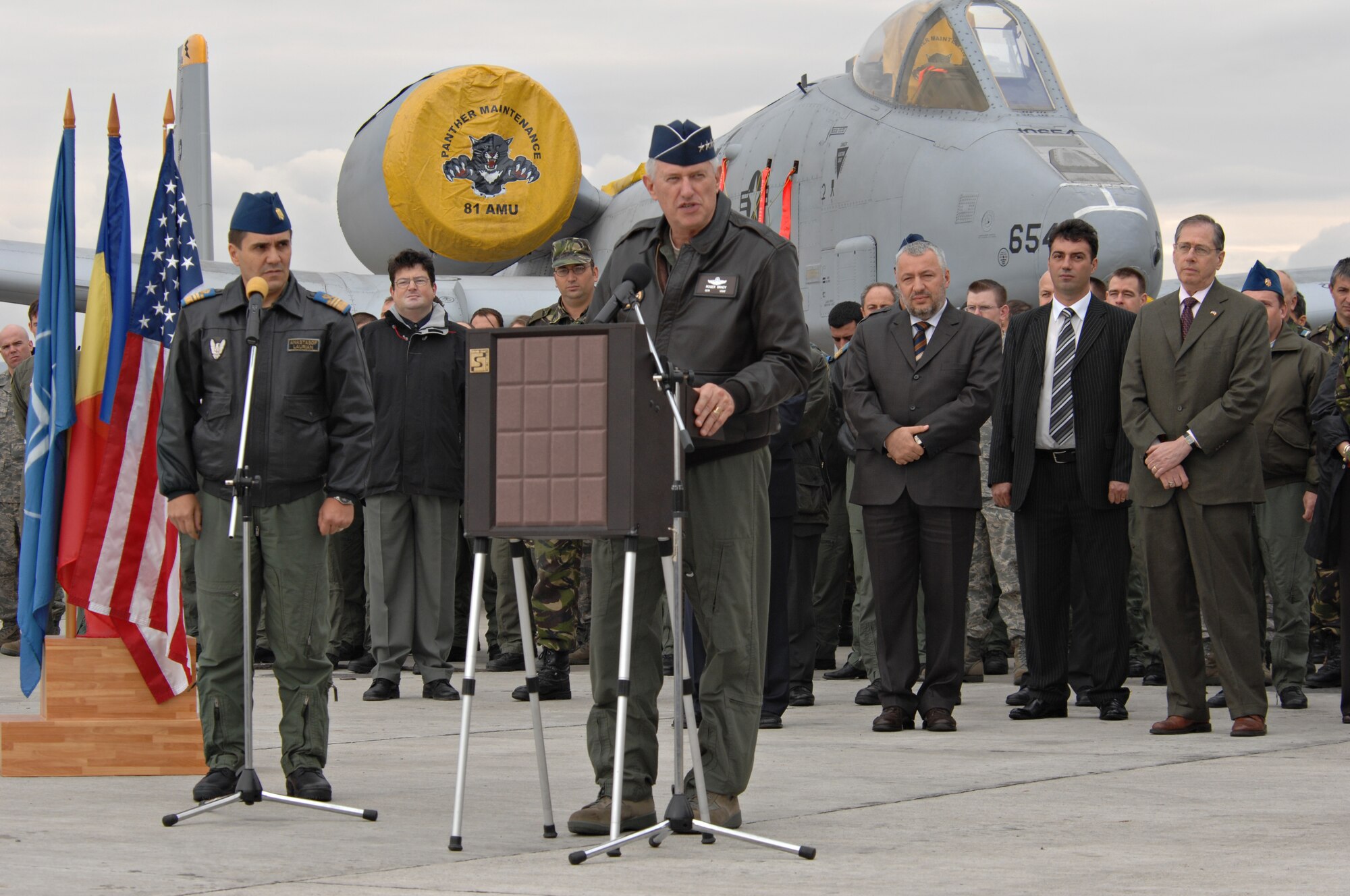 CAMPIA TURZII, Romania – Gen. Roger Brady, U.S. Air Forces in Europe commander, speaks to U.S. and Romanian Airmen, and the Romanian press on the flightline of the 71st ABW in Romania Oct. 28. General Brady; Mark Gitenstein, U.S. Ambassador to Romania; and Maj. Gen. Ion-Aurel Stancui, Chief of Staff of the Romanian Air Force; visited the base during Operation Dacian Thunder. During the combined training exercise the U.S. Air Force flew about 100 sorties; half of which were flown with the Romanian air force. (U.S. Air Force photo/Senior Airman Benjamin Wilson)