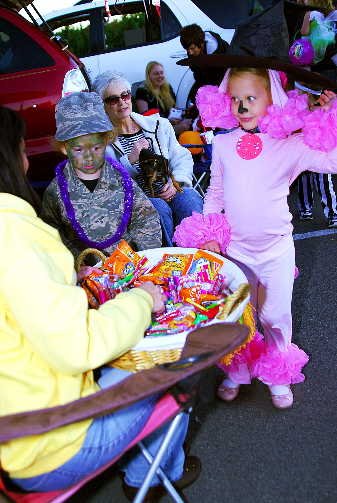 Children of Team Little Rock Airmen participate in a Trunk-or-Treat event Saturday at the base’s War Fit Track. During the event, hosted by the 19th Airlift Wing Spouses Group, families decorated the trunks of their cars or vans and handed out candy to children as an alternative to door-to-door trick-or-treating. Prizes for the best-decorated trunks were donated by the Little Rock Spouses Club. (U.S. Air Force photo by Staff Sgt. Juan Torres)
