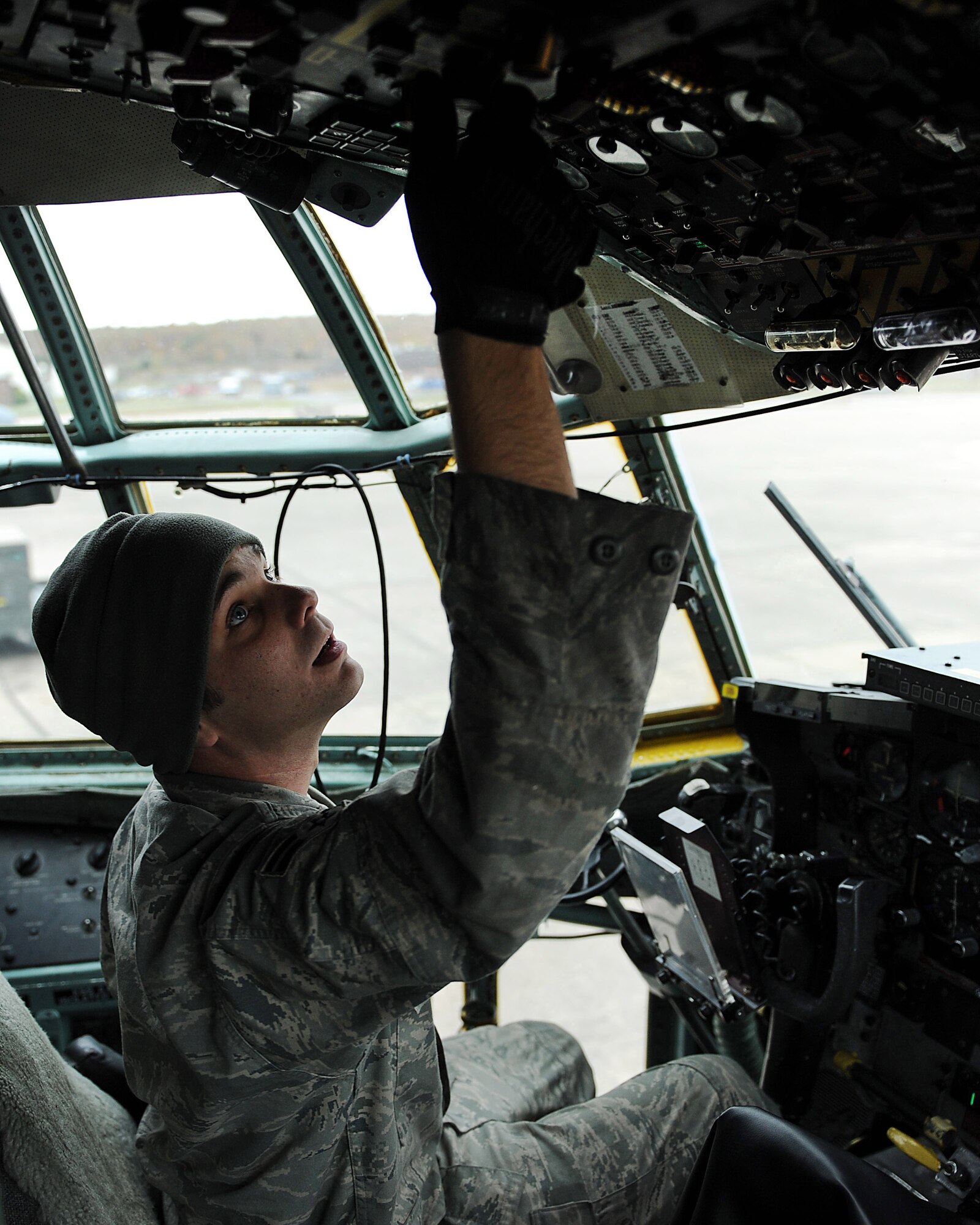 Airman First Class Daniel Elmore, a 314th Aircraft Maintenance Squadron crew chief, checks an aircraft’s battery gauge Oct. 26 for proper voltage in the cockpit of a C-130 during an extensive  basic post flight/preflight inspection Oct. 26.  (U.S. Air Force photo by Staff Sgt. Chad Chisholm)