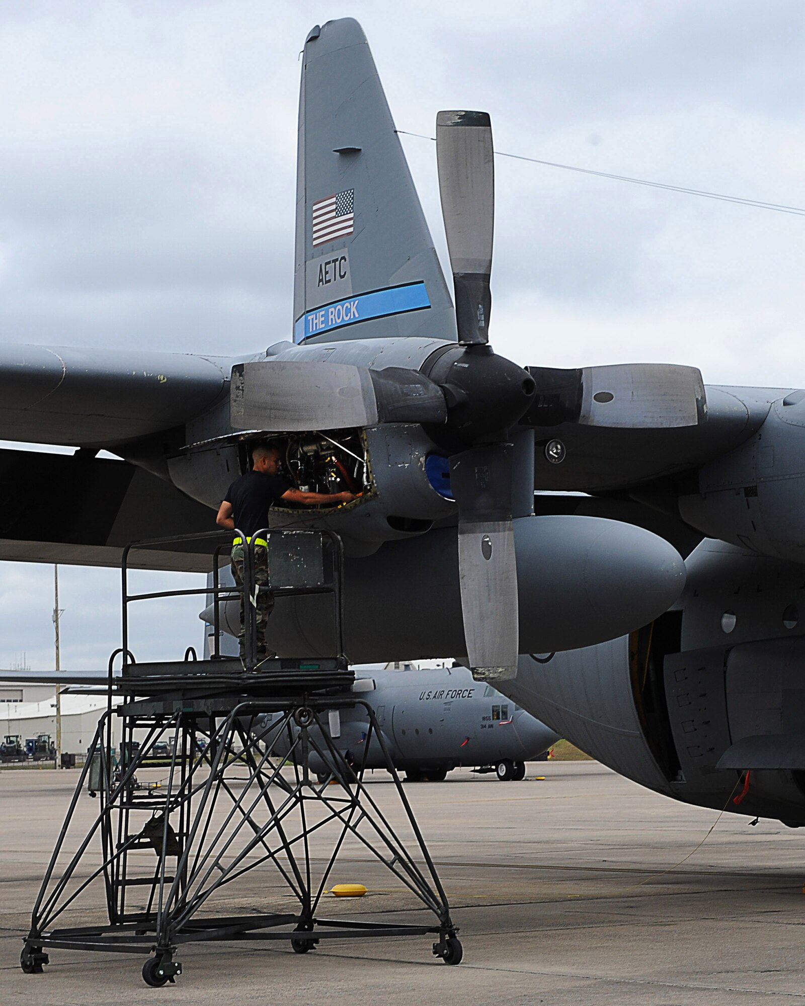 Senior Airman Frank Santiago, a 314th Aircraft Maintenance Squadron crew chief, visually checks the interior of a C-130 engine during his basic post flight/preflight inspection Oct. 26. (U.S. Air Force photo by Staff Sgt. Chad Chisholm)