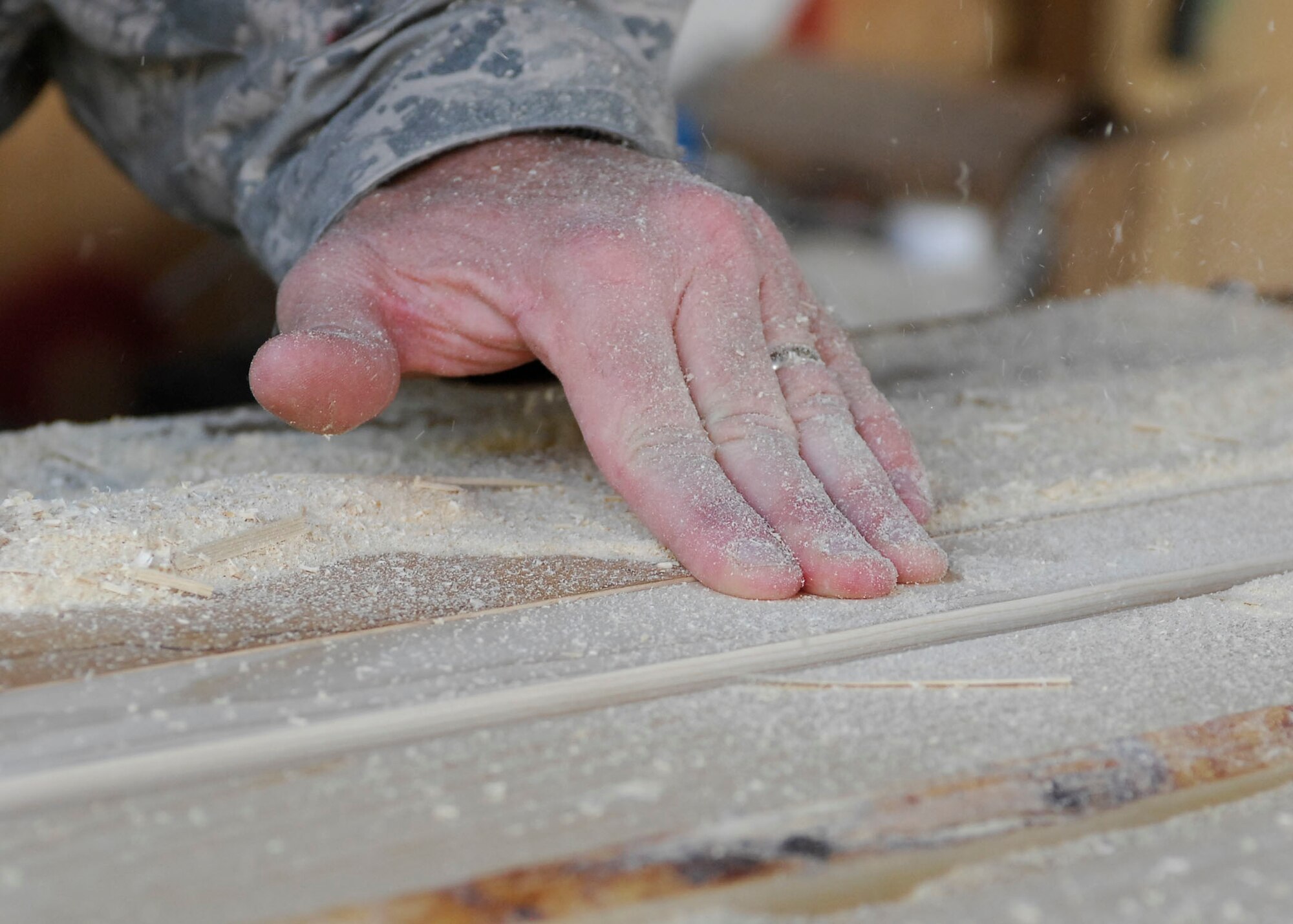BAGRAM AIRFIELD, Afghanistan -- Staff Sgt. Troy Jorgenson, an engineering assistant from the 455th Expeditionary Civil Engineering Squadron, uses a router to cut the edges of plywood to make picture frames for the wing headquarters building Oct. 29, 2009.  The 455th ECES is responsible for building anything from frames to offices for the Air Force personnel on Bagram Airfield.  Sergeant Jorgenson is deployed from the Nevada Air National Guard's 152nd CES, and hails from Reno, Nev.  (U.S. Air Force photo/Senior Airman Felicia Juenke)