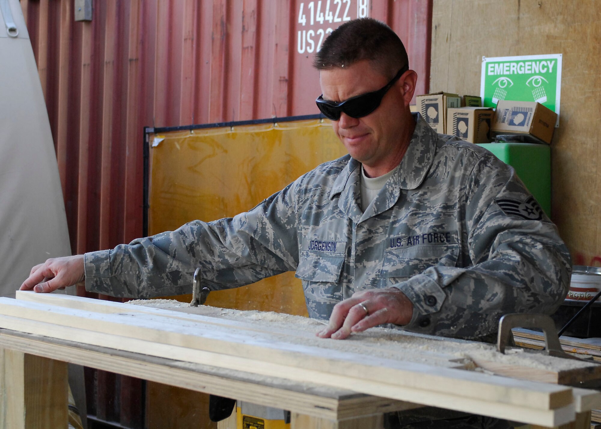 BAGRAM AIRFIELD, Afghanistan -- Staff Sgt. Troy Jorgenson, an engineering assistant from the 455th Expeditionary Civil Engineering Squadron, uses a router to cut the edges of plywood to make picture frames for the wing headquarters building Oct. 29, 2009.  The 455th ECES is responsible for building anything from frames to offices for the Air Force personnel on Bagram Airfield.  Sergeant Jorgenson is deployed from the Nevada Air National Guard's 152nd CES, and hails from Reno, Nev.  (U.S. Air Force photo/Senior Airman Felicia Juenke)